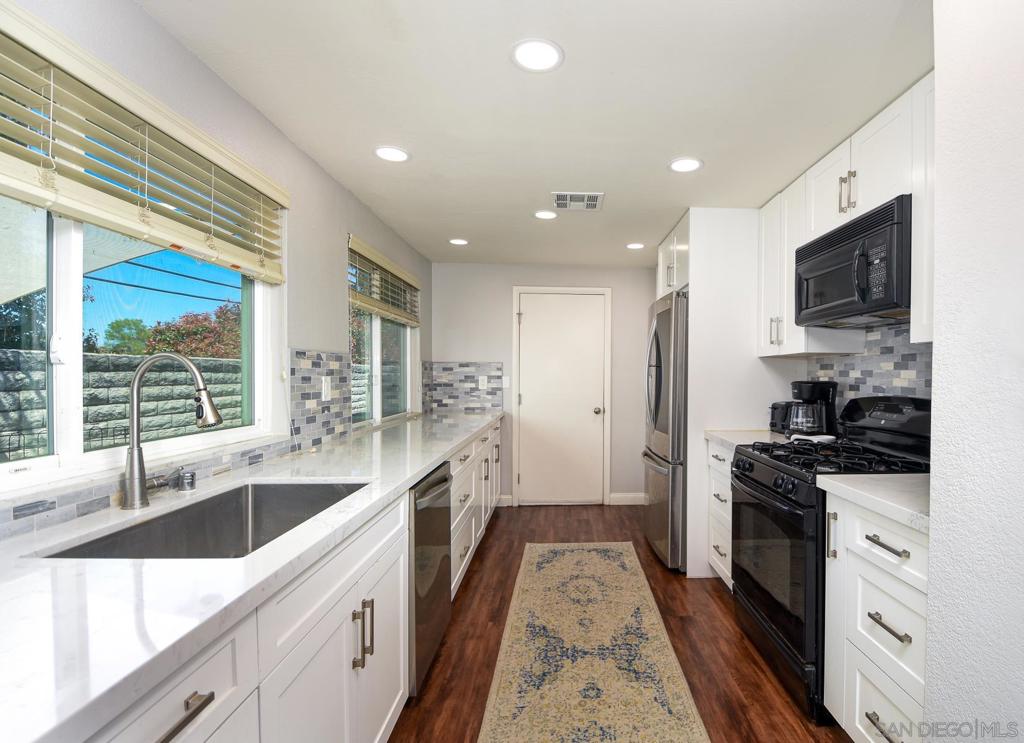 AVAILABLE FOR MOVE IN JULY 1ST! Located in Jeffries Ranch, this single story townhome in a cul-de-sac is a must see for buyers looking for a great location and lots of upgrades! This home has a gorgeous galley kitchen with custom cabinets, quartz countertops, newer slide out shelving in pantry, newer dishwasher, recessed LED lighting with dimmer switch and tons of counterspace make this modern kitchen space both functional and beautiful. With an open floorplan, the home flows seamlessly from one space to the next. The secondary bedrooms share a full jack and jill bathroom that has been updated with lovely finishes. Enjoy the high ceilings in the modernized master bedroom which features dual mirrored closets and a slider leading outdoors, creating a charming and cozy vibe. Master bathroom features newer countertops, cabinets and finishes. Newer flooring throughout the home, a 2 car attached garage, newer dual pane windows, easy maintenance artificial turf in the backyard. The home features solar with a payment of $62/monthly! No neighbors to the right, community swimming pool just across the street, lots of park spaces with green grass and trees for shade really adds to the peaceful setting here at Mission Meadows. This home is move in ready condition, has guest parking in the cul-de-sac, close to all, a single story gem awaits your buyers! No Smoking, 1 year min lease required, 1 animal permitted.