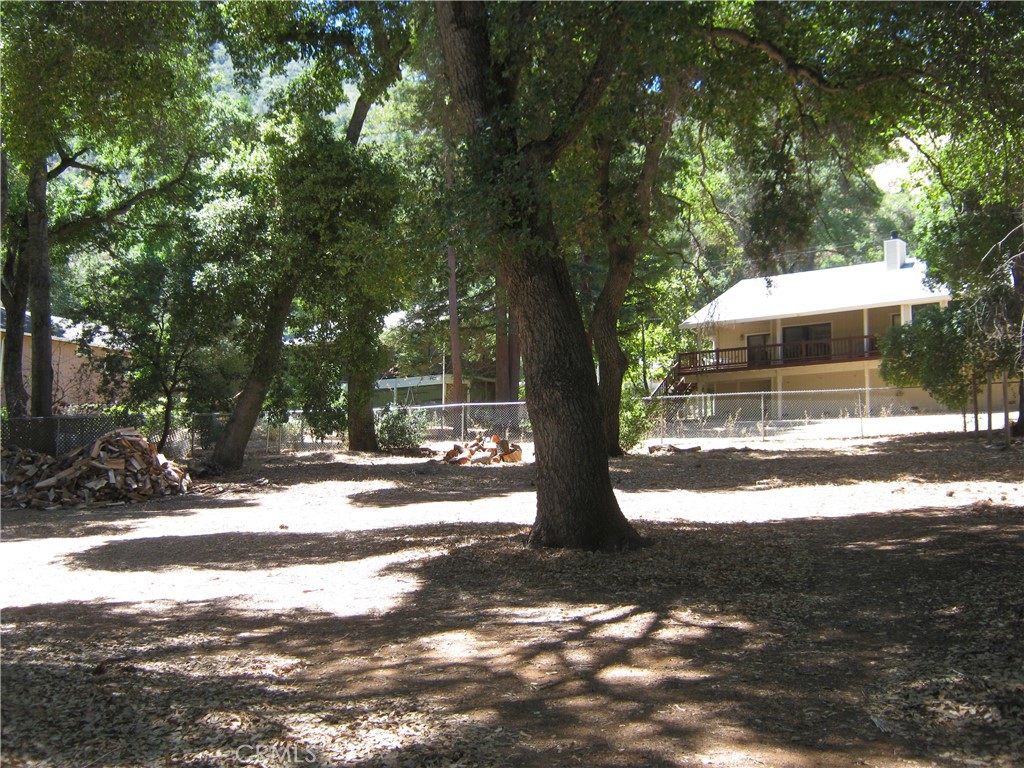 Quiet serene property at the end of the court. Mature trees on the property. Water Meter has been paid for. Close to Clubhouse, Golf Course and Boat Launch.