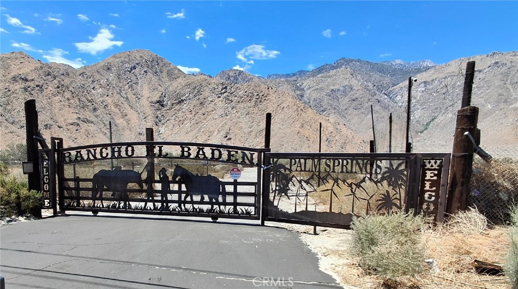 A unique 10-acre property consists of two adjacent 5-acre parcels in the Windy Point area of Palm Springs. Located off Hwy 111 and Overture Drive.
Take Overture to Purple Sage, turn left toward the mountains. Purple Sage turns into Sterling Trail. Look for the large gate right in front of you.
It is a great location for a residence, housing tract, or mobile home park. Zoning would need approval from the County.
The property was used as a residence and horse ranch. The property features a few mobile homes, several outbuildings, and a large shop. Value lies in the land; the mobile homes on the property require major rehabilitation or removal.
Property is offered in as-is condition. The seller is unfamiliar with the condition and local regulations. The buyers are to satisfy themselves as to condition, possible uses, zoning, building codes, etc.