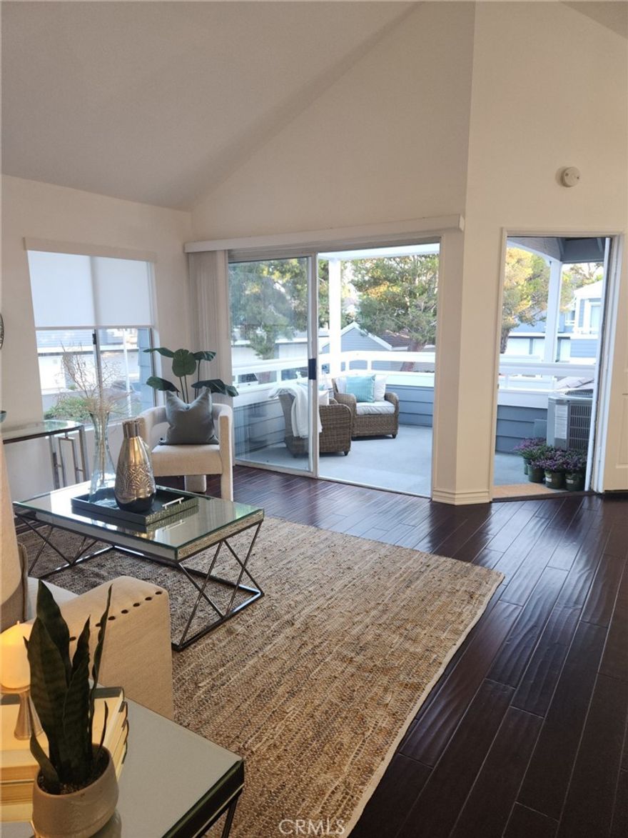 Absolutely Gorgeous Newport Beach Condo in the Luxurious Bayridge Community. One of the best locations in the neighborhood with Tree Views and plenty of privacy. The beautiful dark hardwood floors throughout welcome you home into huge great room style living. Tall vaulted ceilings extend from the gourmet kitchen to dining and family rooms. The chefs kitchen is equipped with all stainless steel appliances including commercial gas range, and wine fridge. Gorgeous granite counter tops with breakfast bar overlook the family room. Master bath has been remodeled with granite counters, designer hardware and fixtures. Huge windows throughout the home let plenty of light in and are all covered by custom wood plantation shutters. Scraped ceilings, recessed lighting, new baseboards, doors and casing throughout. Home has central AC / Heat. Inside laundry too! Outside the home you'll find a large patio. Beautiful resort style community pool and spa for swimming and sunbathing. Close to Fashion Island, Newport Center, Back Bay nature preserve, freeways and the Beach. Don't miss this one, it is turn key ready to move in. Call Bill Calhoun 714-322-2201 to enter property during open house.