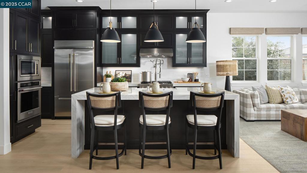 Welcome to Regency at Tracy Lakes, where luxury living takes center stage in this active adult 55+gated community. Three picturesque lakes, this vibrant community offers a fishing dock, 1-acre community garden and dog park. With a wealth of amenities, including a clubhouse, pools, cabanas, yoga studio, fitness center, bocce ball, and pickleball courts, every day is an opportunity for relaxation and recreation. The onsite lifestyle director ensures there’s always something to look forward to; from fitness classes to comedy shows and wine nights. Appealing foyer hallway reveals the expansive great room, with access to the luxury outdoor living space beyond. Well-appointed kitchen offers a large center island with breakfast bar, KitchenAid stainless steel appliances, 36" gas cooktop, quartz countertops, designer tile backsplash, shaker style modern cabinets with Beech Nutmeg stain finish, and an ample walk-in pantry. The private primary bedroom suite has a roomy walk-in closet, and a spa-like bath with dual-sink vanity, a large luxe shower with seat. Elegant craftsmanship, with 10-foot ceilings, 8-foot doors, 5 1/4" baseboards, dual-pane Anderson windows and Western sliding doors. Create your ideal space with a generous flex room (photos not of actual home, for marketing only)