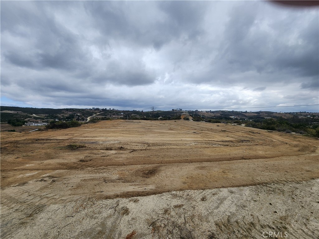 Land Lot with AMAZING VIEWS 4.20 Net Acres / 5.45 Gross Acres Located off East Benton Road and De Portola Road both paved roads. The parcel is next to 3 other 5 acre parcels that are all accessed by a road easement that runs along the bottom South East end of all 4 parcels. The other 3 lots are under MLS # SW25085855. This is raw land but has access to electricity that runs along De Portola Road. The parcel has full water rights so new owner will need to drop a well.