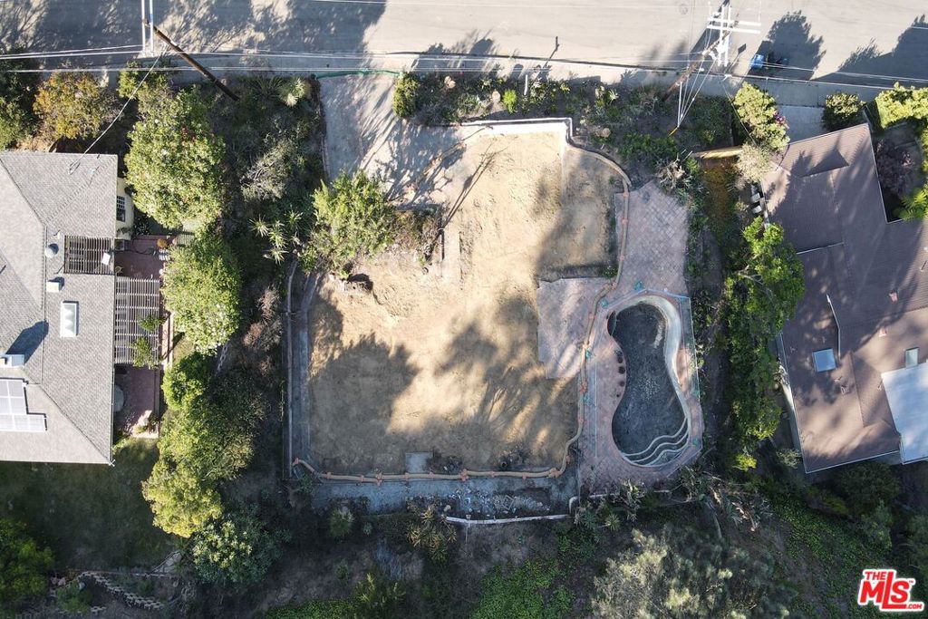 Situated above the Alphabet Streets on the highly desirable Marinette Road, this over 19,000 sqft lot presents endless possibilities. One of the largest lots to come to market in the area this year. Previous home was a single story 2,079 sqft home with a pool. Underbuilt report is available and shows that a substantial home is possible. 5 homes on the road have previously sold for between the price range of $7,000,0000 and $12,000,000. Phase 1 and 2 debris removal have been completed. Be a part of the Palisades rebuild with a highly desirable property.