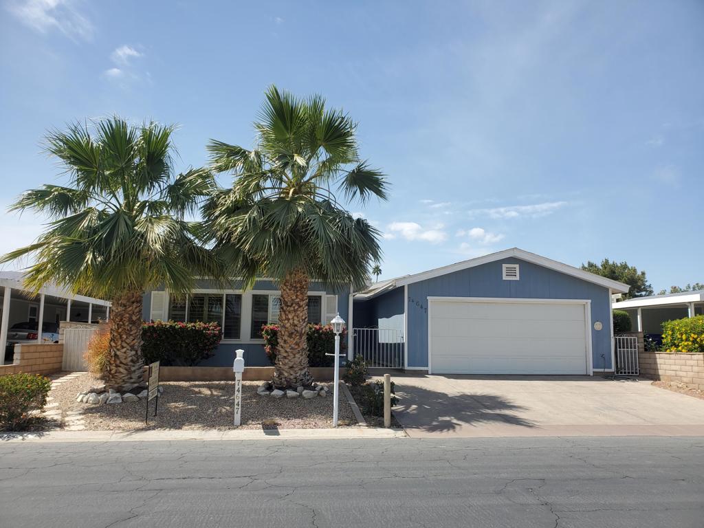 This exceptional 3 bed/2 bath home, complete with an attached 2 car Garage, is ideally situated in the picturesque Portola Country Club, nestled in the heart of Palm Desert. The property displays pride of ownership from the moment you walk in and boasts an array of premium features, including upgraded wood laminate flooring, modernized kitchen appliances, granite slab counters, a renovated walk in shower in the primary bathroom and white shutters throughout. Enjoy the added convenience of an indoor laundry area and an open floor plan that flows effortlessly throughout. As part of a 55+ community, homeowners benefit from low monthly HOA fees ($440), which grant access to an array of amenities, including unlimited golf for two, complimentary cable and internet services, free trash collection, three community pools and spas, a clubhouse, tennis and pickle ball courts, bocci ball courts, a fitness center, and a cafe. Most importantly you own the land!