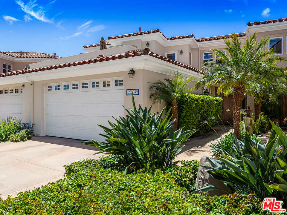 This spacious and thoughtfully upgraded two-bedroom, two-and-a-half-bath townhome is located in Toscana, a gated, 22-residence community in the heart of Malibu. Bright and modern with iPad-controlled smart home features and a full security system with cameras, this turnkey property offers both comfort and future potential with design plans to add a third bedroom. The main living area opens to a private backyard with piped gas for a BBQ grillideal for indoor-outdoor entertaining. The chef's kitchen features Viking appliances and a gas range, while both upstairs bedrooms include ensuite baths, private balconies, and walk-in closets. The primary suite is complete with a jetted spa tub. Other highlights include an attached two-car garage with built-in storage, a dedicated laundry room, Noritz tankless water heater, dual-zone HVAC, and a LifeSource whole-home water filtration system. Toscana offers resort-style amenities including a pool, spa, gym, and clubhouse. With strict HOA rules against short-term rentals, the community maintains a peaceful, neighborly feel. Just minutes from Pepperdine, Malibu's best beaches, parks, the Pier, Whole Foods, and the Country Mart. A rare chance to own a smart, stylish Malibu townhome with room to grow.