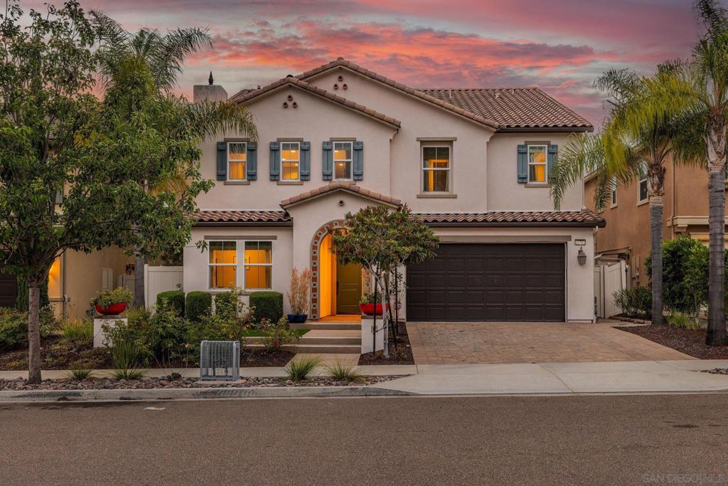 Welcome to 12712 Cloudbreak Ave – a former model home that blends thoughtful design with canyon views, smart upgrades, and space to grow. Nestled in the desirable Sea Cliff community and served by the award-winning Poway Unified School District, this 5-bedroom + loft, 4.5-bath residence offers 3,600 sq ft of beautifully maintained living space on a 6,144 sq ft lot. Inside, the open, sun-splashed layout showcases hardwood floors, designer finishes, and custom built-in cabinetry in the living room, loft, and bedrooms—including both primary closets. Every bedroom features a walk-in closet, and the home shows remarkably little wear. The chef’s kitchen is the heart of the home, boasting quartz countertops, a large center island, high-end Moen plumbing fixtures, top-tier appliances, and a walk-in pantry. A first-floor bedroom with en-suite bath adds flexibility for guests, multigenerational living, or a private office. Upstairs you’ll find four additional bedrooms, a versatile loft, and a spacious primary suite with luxe finishes and abundant built-in storage. Fresh paint, pristine carpeted bedrooms, and a whole-house water softener with reverse-osmosis drinking water elevate everyday comfort. Slide open the 5-panel accordion doors to a canyon-facing backyard oasis—no rear neighbors, just serenity. Enjoy a tranquil fountain, low-maintenance artificial turf, a covered California Room with surround-sound speakers, modern lighting, and fruit trees that add a sweet touch of nature. It’s perfect for al-fresco dinners, weekend hangouts, or stargazing nights. Practical perks include a tankless water heater, Tesla charger, and whole-house speaker system—and best of all, no Mello-Roos tax. Built in 2016 with timeless upgrades and practical luxury, this move-in-ready home is minutes from top schools, parks, and freeway access. Discover the perfect blend of style, comfort, and canyon tranquility at 12712 Cloudbreak Ave.