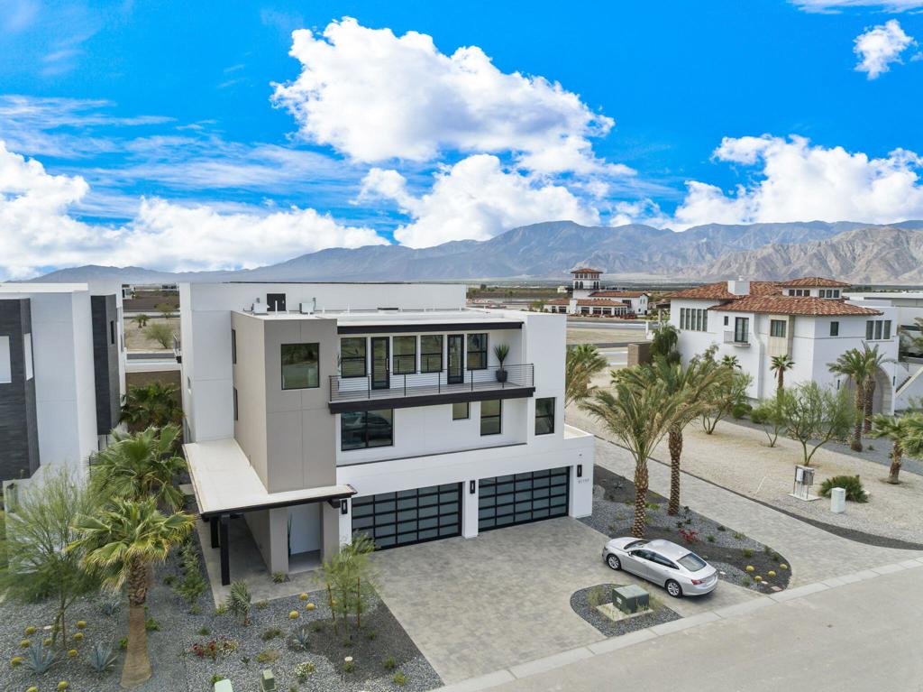 Newly Built and Beautifully Appointed Villa with a Premium 'On Track' Location. Fully Furnished and Turn Key. Approximately 15,000 SF with 5 Bedrooms, 6 Full Baths Plus 2 Powder Rooms. Unique Lot Features Amazing Views of Track & Mountains. No Neighbors on West Side. 5,000 SF Garage Space for 20 Cars, Plus 3 Full Size Garage Door & Side Driveway For Easy Access. Garage Includes Office, Full Bathroom and Storage Closets. Second Floor Features Four Large en-suite Bedrooms, Powder Room, Laundry Room, Large Living Room, Wet Bar with Microwave, Refrigerator, Ice Maker and Second Floor Deck. Third Floor is Main Living Area, Primary Bedroom with His and Hers Toilets and Closets, Custom Glass Wine Room, Large Kitchen with Full-Size Sub-Zero Refrigerator and Freezer, Walk in Pantry, Living Area and Full Bar with Sink, Refrigerator and Ice Maker. Extra Large Deck with Built in BBQ. Crestron Home Controls System for TV, Shades, Climate, Garage Doors and Music & Axis Security Camera System. Purchasing a Villa at The Thermal Club Requires Purchasing a Membership. Standard family membership has a one-time initiation fee of $175,000 plus membership dues of $2,400/month and a small $250/month ground maintenance fee per lot per month.