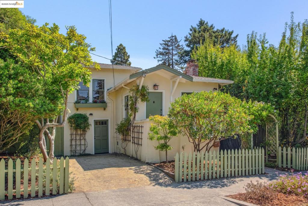 Nestled in a vibrant North Berkeley neighborhood, 2140 Rose St is a charming split-level home dating from the early 1920s. As you enter from the front porch into the living room, the door swings closed and you immediately leave behind the hustle and bustle for peace and quiet. A fireplace is the focal point of the living room, while the hardwood floors flow directly into the dining room, featuring traditional built-in cabinetry. Beyond is the sunny kitchen with a skylight, new appliances, enchanting breakfast nook and access to the back deck and yard. Back inside, take a few steps up and you’ll find two bedrooms, a full bathroom and plentiful storage. Alternatively, a few steps down will take you to the third bedroom, second bathroom, laundry closet and media room. The side yard features a storage shed perfect for bikes, while additional storage spaces can be found under the deck. Just blocks from renowned spots - the original Peet’s Coffee, Fava, Chez Panise, Cheeseboard, the farmer’s market, Live Oak Park and approximately half a mile from UC Berkeley, 2140 Rose allows you to live in the middle of it all, while feeling completely serene.