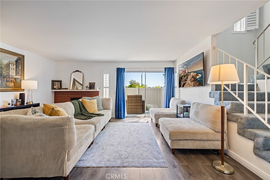 Award-winning Walnut Valley School District presents a beautiful two-story condo in the heart of Diamond Bar. Welcome to 1007 Flintlock Road — a stylishly updated corner unit offering 2 bedrooms, 1.5 bathrooms, and 1,241 square feet of thoughtfully designed living space. Nestled in one of the area’s most desirable communities, this light-filled home is ideal for first-time buyers, down-sizers, or anyone seeking comfort and convenience in a prime location. Step inside and immediately notice the abundance of natural light that fills the home, enhanced by high ceilings that create an open and airy atmosphere. The spacious living, along with a fireplace, and dining area flow seamlessly, making entertaining easy and enjoyable. The kitchen is a standout feature, boasting mid-century modern design elements that blend style and functionality—ideal for those who love to cook or simply enjoy a well-designed space. Throughout the home, you'll find newer flooring and fresh paint that add a clean, modern touch, while the recently updated HVAC system ensures year-round comfort and efficiency. As a desirable corner unit, this home offers additional privacy and peaceful surroundings, with no neighbors on one side. Located just minutes from shopping, dining, and easy access to major freeways, this home offers a commuter-friendly lifestyle without sacrificing tranquility. Whether you're relaxing at home or enjoying the convenience of nearby amenities, 1007 Flintlock Road combines timeless design with everyday practicality in one of Diamond Bar’s most established communities. Don’t miss your chance to make this move-in ready gem your own