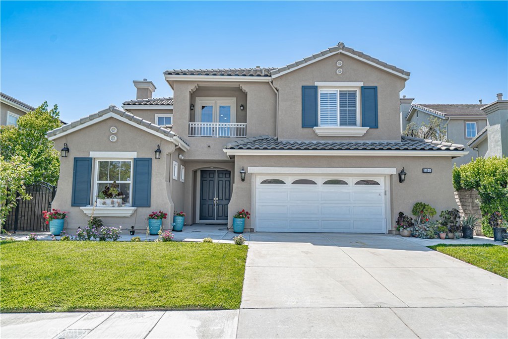 Welcome to this beautifully upgraded 5-bedroom, 4.5-bath home in the heart of Stevenson Ranch! This spacious 3,474 sq. ft. home features an open floor plan with a family room, formal dining room, and a bonus entertainment room. The remodeled kitchen offers granite countertops, a large island, stainless steel appliances, and plenty of storage. Enjoy the convenience of a downstairs bedroom with a full bath, perfect for guests or multi-generational living. The large primary suite includes dual walk-in closets and a spa-like bathroom. All bathrooms are beautifully updated with marble finishes. This home is packed with smart and energy-efficient features, including a 12.4 kW solar system (average savings ~$250/month), EV charger readiness, soft water service, and hardwired internet throughout. The private backyard is perfect for entertaining, with a covered patio, fruit trees, and professional landscaping (gardener included). Additional highlights: two-car garage with storage, recessed lighting, crown molding, and two cozy fireplaces. Located near top-rated schools, parks, and a community playground.