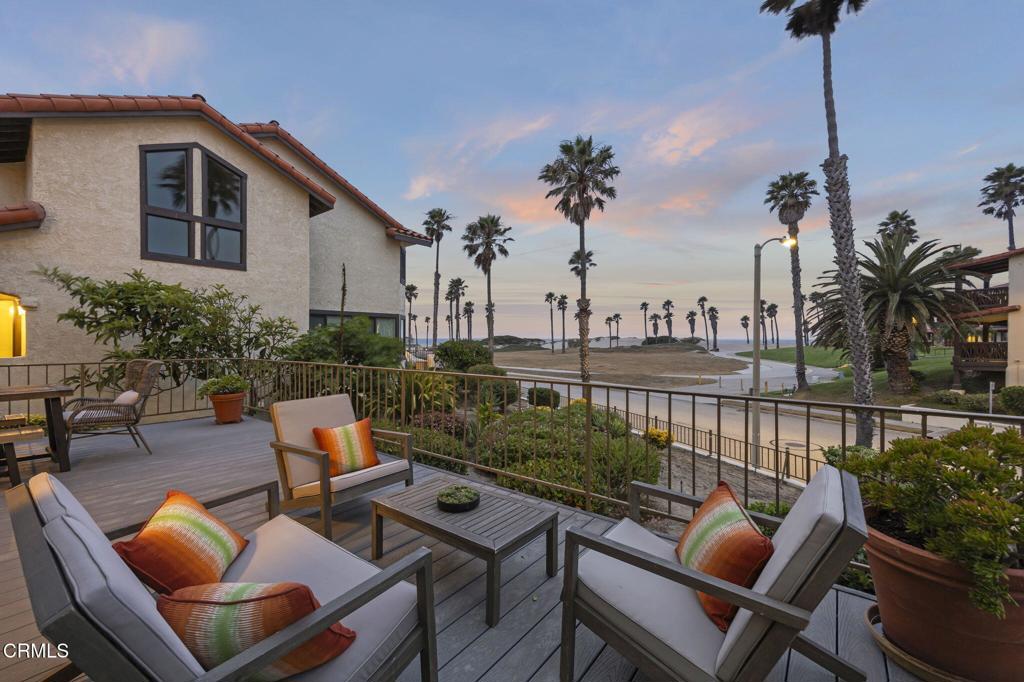 Welcome to beachfront living in the highly sought-after Colony at Mandalay Beach, where unobstructed ocean views and resort-style amenities create the ultimate coastal retreat. This beautifully updated 3-bedroom, 3-bathroom townhome offers over 2,059 square feet of light-filled living space, thoughtfully designed for both comfort and style. Enjoy stunning ocean views from nearly every room--including both decks, the living room, kitchen, dining area, primary suite, and even the spa-inspired primary bathroom.The expansive living room features a striking fireplace and large windows that frame the breathtaking coastline while inviting in soft ocean breezes. The chef's kitchen is finished with granite countertops, stainless steel appliances, and an open-concept layout that flows seamlessly into the dining area--ideal for entertaining or relaxed seaside living. Upstairs, the spacious primary suite provides a serene escape with dual vanities, heated flooring, a generous walk-in closet, and sweeping ocean views. A private guest bedroom and full bath are located on the main level, offering flexibility for visitors or multi-generational living. The attached two-car garage adds convenience and security. As a resident of The Colony, you'll enjoy 24-hour gated access along with exceptional amenities such as resort-style pools and spas, tennis courts, a racquetball court, pickle ball court, fitness center, clubhouse, and beautifully landscaped greenbelts.Just moments from the sand, local farmers market, and summer concerts in the park, this home offers the perfect blend of luxury and low-maintenance beachside living. Whether you're looking for a full-time residence or a weekend escape, this townhome is move-in ready and truly one-of-a-kind.