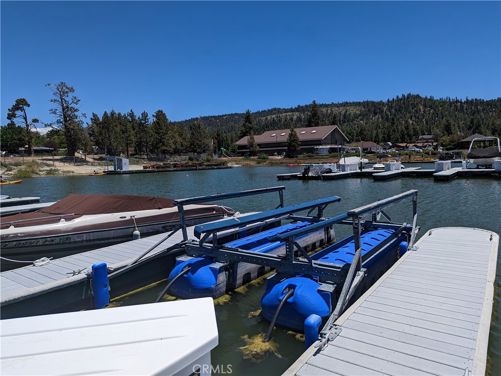 Turn yourself into a lake access owner with a fee-simple dock, AKA Dockominium, at the Pine Knot Dock Club, the only one of its kind on Big Bear Lake. Dock Club members enjoy parking passes, private restrooms, private entrance for after hours on the lake, dockside electric, video surveillance, nearly a ringside location to watch the fireworks AND this dock includes a HYDROLIFT to raise your boat while not using it. This location is very convenient to the fueling dock. There is also on-site management, a concierge, and a Marine center along with several other concessions. The dock will accommodate a 22-foot boat.
