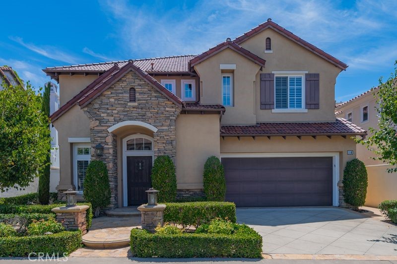 Located behind the gates of the highly sought-after Tesoro Crest, this immaculate residence offers the perfect balance of luxury, function, and prime Newport Coast living.
This two-level home features 4 spacious bedrooms and 3 full bathrooms, including a desirable main-floor bedroom with adjacent full bath — perfect for guests, in-laws, or a private home office. A welcoming entry with soaring ceilings, hardwood floors, crown molding, plantation shutters, and abundant natural light sets the tone for refined living.
The gourmet kitchen is the heart of the home, appointed with granite countertops, an oversized island, built-in breakfast nook, and seamless flow into the expansive Great Room with cozy fireplace and French doors that open to a private backyard retreat.
Upstairs, the resort-style primary suite boasts custom California Closets, dual vanities, a soaking tub, and walk-in shower. A spacious upstairs laundry room with sink adds convenience. The attached 2-car garage offers built-in cabinetry for storage.
Set on a quiet interior street, residents of Tesoro Crest enjoy gated privacy, access to two community pools, and walkability to Coastal Canyon Park, shopping, and the award-winning Newport Coast Elementary School.
Turn-key and move-in ready, this rare floor plan combines elegance with everyday comfort — a true gem in Newport Coast.