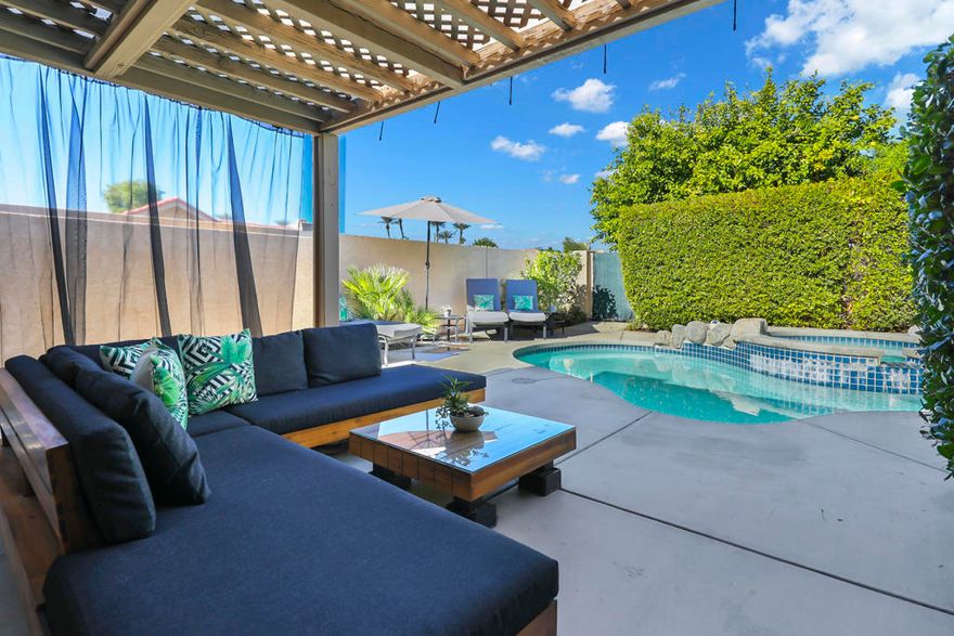 The only Condo in Silver Sands RC with a private pool, spa and putting green! Welcome to ''21 PARADISE'', a stunning desert retreat nestled in the highly sought-after Silver Sands Racquet Club in the heart of Palm Desert. Ideally situated in the middle of the community, this beautifully maintained residence offers the perfect blend of comfort, privacy, and resort-style living. Soaring ceilings and abundant natural light with an open area on one side and a wraparound patio create an airy, open feel throughout the home, while the well-designed floor plan is ideal for both full-time living or seasonal escapes. Step outside to enjoy your own private pool and spa or choose to use one of the many community pools/spas. There are lush greenbelts just steps from your door that meander throughout the community. Silver Sands is a private gated community known for its vibrant tennis and pickleball culture with an overall lively social lifestyle, featuring a clubhouse, fitness center, and numerous community events. Located just minutes from world-class shopping and dining on El Paseo, renowned golf courses, and endless outdoor recreation. Next door to that are restaurants, grocery stores, pharmacy, coffee shop, dry cleaning and more. Right next-door is the JW Marriott Desert Springs Resort while across the street is one of the most beautiful public golf courses in the valley, Desert Willow. Whether you're seeking a primary residence, vacation getaway, or investment opportunity, 21 Ensenada Lane delivers the ultimate desert lifestyle!