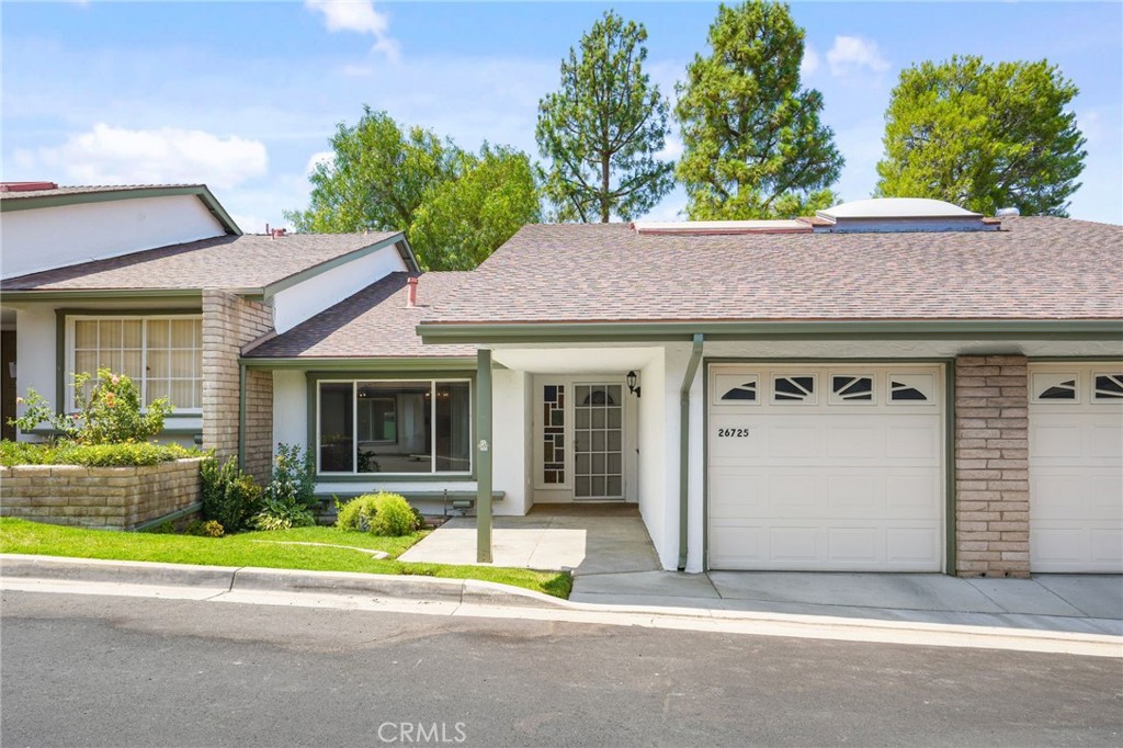 I just LOVE selling in this community! Welcome to 26725 Oak Garden Ct, a charming two-bedroom, two-bathroom residence located in the highly desirable 55+ gated community of FRIENDLY VALLEY. This 1,150 sq ft home offers a truly resort-like lifestyle with beautifully maintained grounds and a wealth of amenities including a 24-hour guard-gated entrance, golf course, newly renovated swimming pool & spa, fitness center, barbecue areas, clubhouse, hobby rooms, and various workshops. This is the perfect place to relax, connect and enjoy life to the fullest. As you enter the home, you're welcomed into a naturally bright living room featuring a cozy fireplace and adjacent dining area accented by a classic chandelier. The updated kitchen offers built-in appliances, ample laminate cabinetry and opens into a den or nook area that leads to a large open-air covered patio with two skylights. This outdoor space is perfect for entertainment or letting your furry companion enjoy the fresh air. The spacious primary suite features a sliding glass door to the patio, a wall-to-wall closet and a spa-like 3/4 bathroom designed for relaxation. The secondary bedroom has access to the hall bathroom and features a unique atrium space, ideal for those with a green thumb. To top it off, this home includes a one-car attached garage, offering secure parking, and additional storage space for added convenience. Don't miss your chance to experience the lifestyle that FRIENDLY VALLEY has to offer.