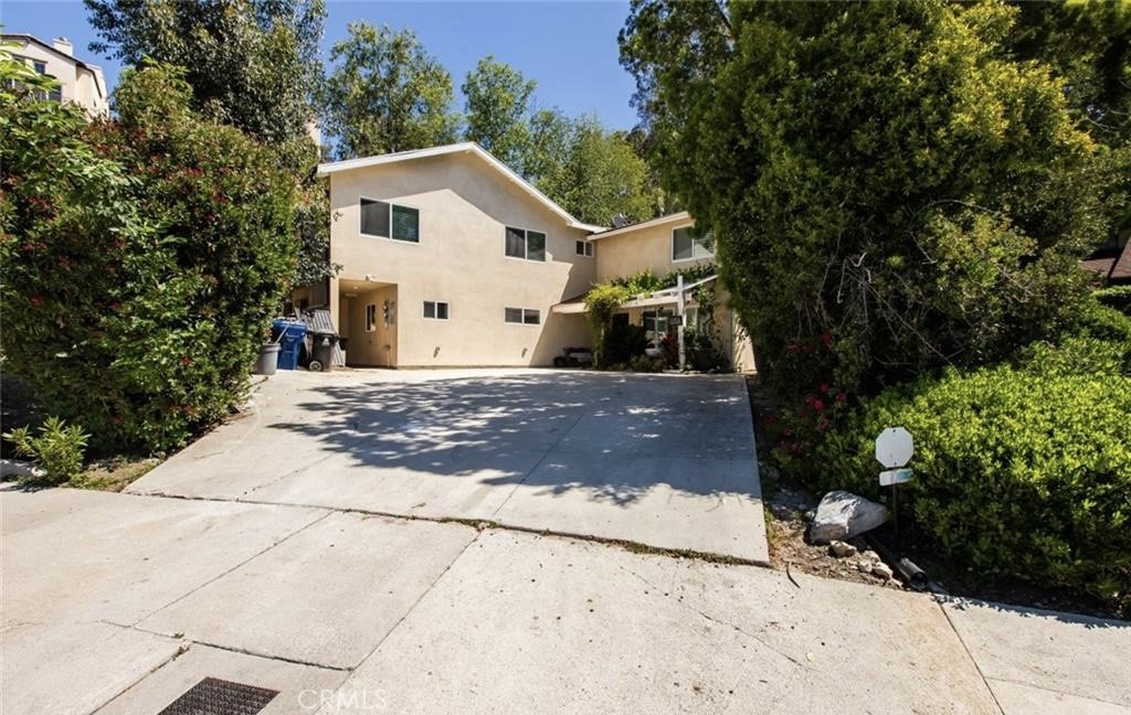 This guest house attached to the main house with its own private entrance is Located in the highly desirable area of Woodland Hills, this stunning 2-bedroom, 3-bathroom unit boasts a prime location and stylish features, including plenty of storage space. With its 2 stories, the unit features an airy open floor-plan, gleaming glossy floors, elegant baseboard moldings, recessed lighting, a stunningly crafted staircase, and a convenient laundry room on the second floor. The modern kitchen is equipped with stainless steel appliances, gorgeous granite countertops, and a cozy breakfast bar for casual dining. The bedrooms are both spacious and well-lit, with the primary bedroom offering a private bathroom, a sizable walk-in closet, and a sliding door that opens onto a balcony with beautiful tree-top views. This ADU is situated next to the main house and has its own private entrance with ample street parking available. Located near the 101-Freeways, the Warner Center, supermarkets, popular dining establishments, the Woodland Hills Branch Library, and Shoup park, this property truly has it all.