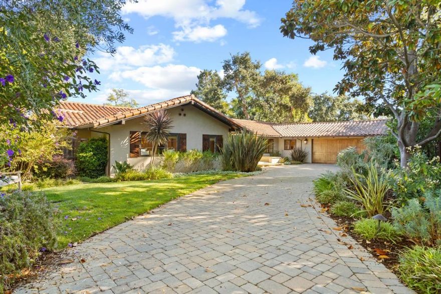 Located on a private cul-de-sac in the heart of Sharon Heights, completely rebuilt in 2008, stunning California Spanish-style inspired home with artisanal details and the highest attention to quality and detail throughout. Gracious exposed wooden beamed living room with charming balcony and Bay Views. Chef's kitchen featuring limestone counters, prep island, pantry and dining nook. Flag stone patio off kitchen offers outdoor dining and entertaining options. Primary suite with cozy fireplace, spa-like bath and walk-in closet. Lower level with polished concrete floors boasts expansive family room, wet bar, wine cellar plus 4th bedroom ensuite. Lush landscaping with exterior patios, fountains, and outdoor seating areas are the perfect spaces for enjoying California living. The location enjoys a peaceful, private setting with close proximity to Sand Hill Road, Stanford University, Palo Alto, shops, easy access to hwy 280. Award winning Las Lomitas schools.