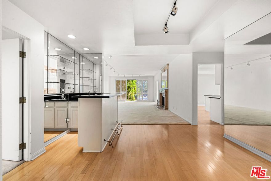 Beautifully Appointed 2BR/3BA Condo in Prime Sherman Oaks Location. Discover comfort and convenience in this spacious 2-bedroom, 3-bath residence tucked away at the end of a quiet cul-de-sac in the heart of Sherman Oaks, just moments from the shops, dining, and nightlife of Ventura Boulevard. Designed for both effortless entertaining and relaxed everyday living, this condo features a generous open layout complete with a wet bar. The light filled living room showcases warm carpeted floors and a cozy gas fireplace, while the formal dining area opens to a private balcony with serene tree and mountain views. The large kitchen is well equipped with a gas range, oven, dishwasher, refrigerator, abundant cabinetry, and an adjoining breakfast nook, ideal for casual meals or hosting guests. Retreat to the oversized primary suite with a spa-inspired bathroom featuring a jetted tub, separate shower, and walk-in closet. The second bedroom includes its own en-suite bath and opens to a large patio overlooking the pool, perfect for morning coffee or evening relaxation. A convenient powder room near the entry is ideal for guests. Additional highlights include in-unit laundry, two assigned ground-level parking spaces, a secured lobby and garage, and excellent HOA coverage including water, trash, master insurance, and exterior maintenance. Community amenities elevate the lifestyle with a pool and spa, BBQ area, recreation room with kitchen, sauna, and guest parking. This is a rare opportunity to enjoy resort-style living in one of Sherman Oaks' most desirable neighborhoods.