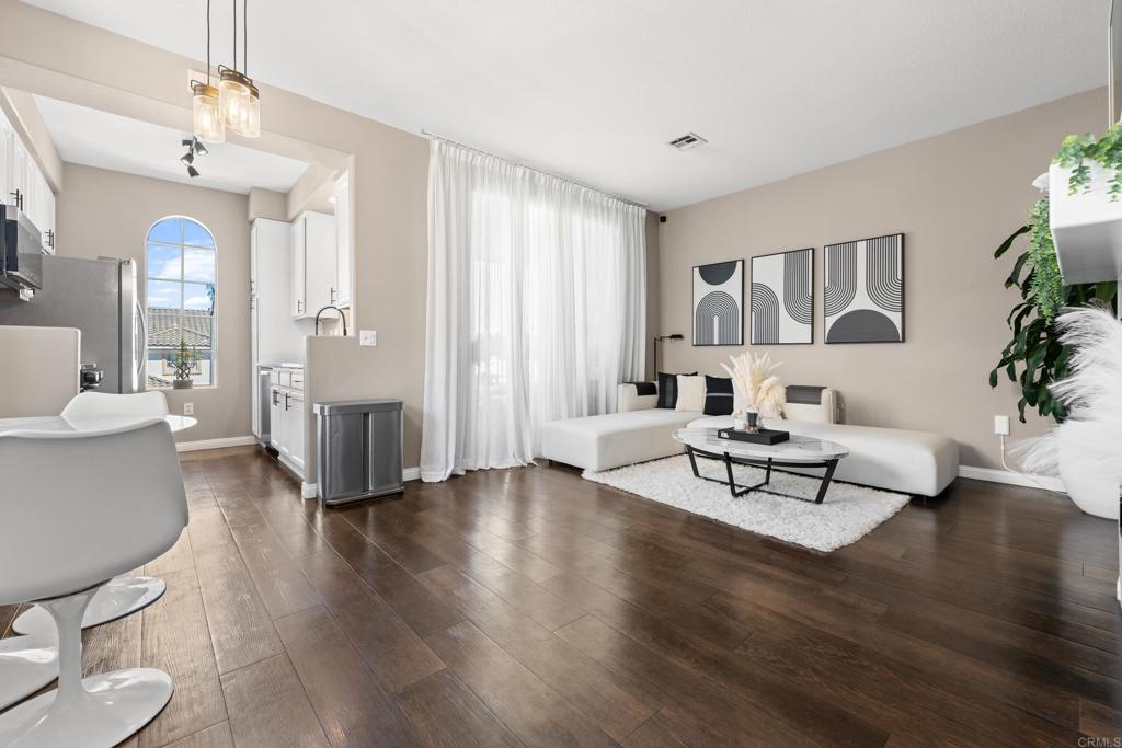 Discover modern elegance and comfort in this beautifully remodeled unit, featuring designer finishes throughout. This upper corner unit in the Villas development of Mira Mesa features a spacious living and dining room with direct access to the covered patio and side by side washer and dryer. Not one detail has gone untouched and a true pride of ownership is evident. 2 assigned parking spaces and conveniently located near shopping, restaurants, schools, public library and Mira Mesa community park.
