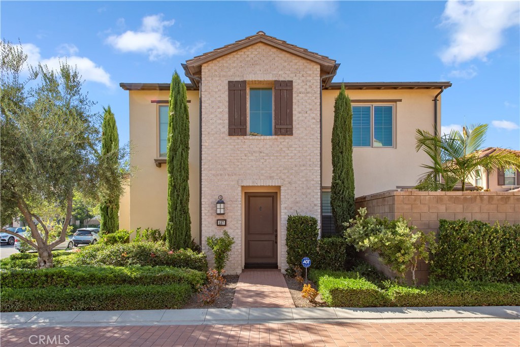 This beautiful home located in the heart of Irvine's desirable Eastwood Village community. Rarely find large premium lot with private driveway in this great location with no shared common wall, just like a SFR. This modern residence offers 3-bedroom, 2.5-bathroom with brand new luxury flooring and new interior painting. The open-concept kitchen is perfect for entertaining, featuring a large center island, white cabinets, and stainless steel appliances. The adjoining dining area is enhanced by expansive sliding doors that fill the space with natural light and offer peaceful garden views. The spacious landscaping in the backyard with almost 5000 sq is perfect for entertaining with artificial turf flooring. Walking a couple minuets to Zion Market, Banks and Restaurants. Enjoy the low HOA fees and property tax rate. Eastwood Village also provides with resort style amenities: pools, club house, parks, trails, sport courts and Irvine Awarded Schools.