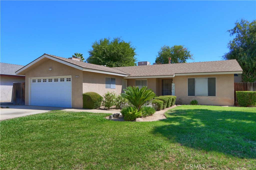 Welcome to this beautifully maintained corner lot home in the desirable Fig Garden area near Stallion Park. This inviting residence offers a popular floor plan with both a living room and family room, featuring a cozy gas fireplace with decorative rock accents and updated luxury laminate flooring. A convenient passthrough connects the living room to the galley-style kitchen, complete with granite countertops, oak cabinetry, stainless appliances, a free-standing cooktop/oven, microwave, dishwasher, and stainless sink. Bar seating makes it ideal for casual dining, while French doors open to the landscaped backyard for easy indoor-outdoor living. The home showcases thoughtful updates throughout, including floating shelves, modern light fixtures, and fresh paint, along with a newer stovetop and hood range. The guest bathroom shines with granite countertops, decorative tile accents, and a tub/shower combo, while tile floors in both bathrooms make for easy maintenance. The spacious master and secondary bedrooms provide comfort and versatility, while the additional family room offers plenty of space for entertaining or relaxation. Step outside to enjoy a generous side yard and grassy backyard, perfect for gatherings, pets, or play. Additional highlights include a two-car garage, rv parking and ample storage, and a move-in-ready condition that makes this home stand out. Located in a quiet, established neighborhood with close access to schools, shopping, dining, and amenities, this home offers a perfect balance of charm and convenience. Happy Labor Day Weekend!