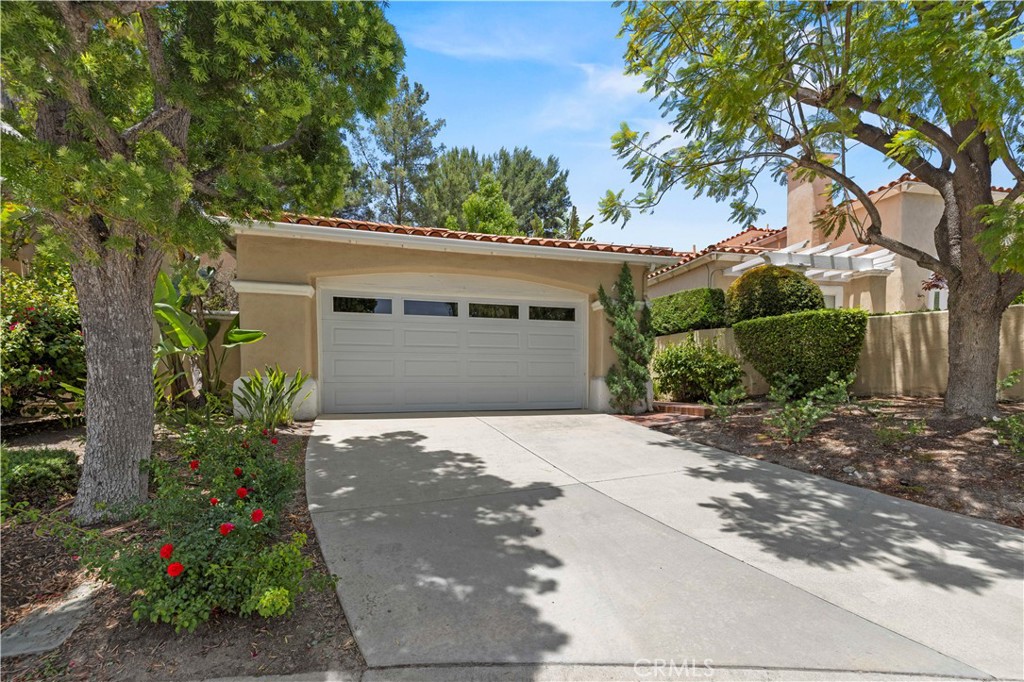 Welcome to 71 Via Barcaza, a beautifully maintained single-level home located in the highly sought-after Los Verdes tract within the prestigious guard-gated community of Coto de Caza. This thoughtfully designed residence offers 2 bedrooms plus a spacious den that can easily be converted back into a third bedroom, making it ideal for those seeking flexibility in a quiet, resort-style setting.
Upon entry, you are greeted with vaulted ceilings, natural light, and an open-concept layout perfect for both relaxing and entertaining. The living room features a cozy fireplace and seamlessly connects to the dining area and a walk-in wet bar, making it an inviting space for hosting. French doors lead to a private back patio with a mature, fruit-bearing lemon tree, offering a serene space to enjoy Southern California’s year-round sunshine.
The spacious primary suite serves as a peaceful retreat. It includes a full-size walk-in closet, double vanity, soaking tub, separate shower, and direct access to a private atrium. The den, which is ideal as a home office, guest space, or playroom, opens to its own separate atrium, providing a unique indoor-outdoor element and added flexibility. A second bedroom and full guest bathroom are located on the opposite side of the home for added privacy.
Additional features include an interior laundry room, a detached 2-car garage located just steps from the front door, ceiling fans, recessed lighting, and low-maintenance landscaping.
Living in Coto de Caza offers a truly elevated lifestyle. Residents enjoy access to miles of scenic hiking and biking trails, equestrian facilities, parks, and optional membership to the Coto de Caza Golf & Racquet Club, which features two award-winning golf courses, tennis courts, a fitness center, resort-style pool, clubhouse dining, and a vibrant social calendar, all set against the picturesque backdrop of the Saddleback Mountains.
Do not miss this rare opportunity to own a well-cared-for single-level home with 3-bedroom potential, custom features, and access to world-class amenities, all offered at an incredible value under $1 million. Schedule your private tour today and experience the charm of Coto de Caza living.