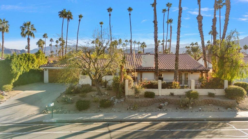 This house has everything you need to relax, entertain and to make it home. Here in the heart of South Palm Desert rests a rustic Southwestern Ranch style home - a generous 2900 square foot retreat on 11,760 square feet of land. It is just minutes away from El Paseo Drive with its many high-end shops and restaurants. This 5BR 4BA home is turn-key furnished. You will love the light interior, featuring exposed beams and wood-planked ceilings throughout most of the home. The heart of the home is the sunny kitchen with its soaring ceilings. There is a casual eating area plus an eat-in bar. Adjacent spaces include a formal dining room for hosting your dinner parties with access to the front yard patio, and the living room with a fireplace which provides a comfortable and warm area to entertain or just to relax. The home is presently has five bedrooms including a large very private master ensuite bedroom which opens directly onto the back patio and pool. There are two additional ensuite bedrooms and two additional smaller rooms that are configured as bedrooms. The large laundry room is centrally located for convenience.The backyard provides a wonderful gathering spot, featuring a pool/spa, outdoor shower, covered patio, with an outdoor kitchen and dining area. Lush landscaping frames the pool with the remaining property landscaped in low-maintenance desert-scape. An oversized two car garage provides loads of storage.