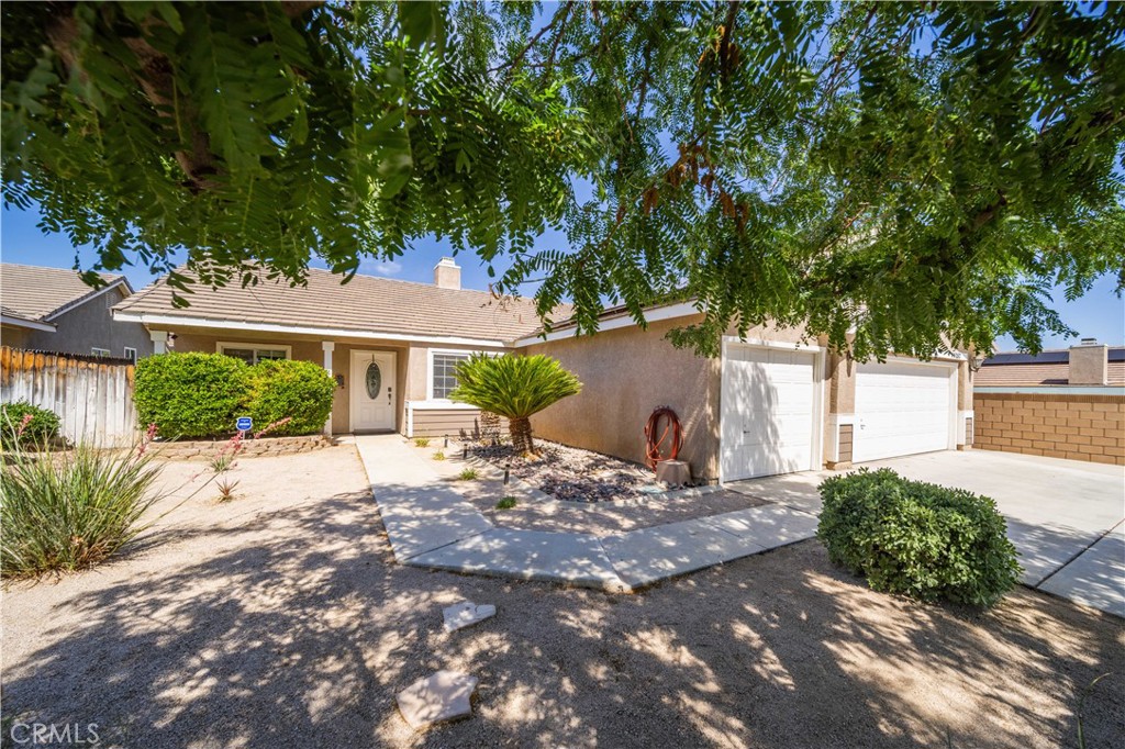 Imagine coming home every day to your own personal retreat. This stunning 4-bedroom, 2-bath pool home, nestled on an oversized cul-de-sac lot directly behind Sundown Elementary, is designed for both blissful relaxation and effortless entertaining. The heart of this home is its completely redesigned kitchen, a true chef's dream. Featuring upgraded soft-closing cabinets, a floor-to-ceiling pantry, an extra-large island for abundant storage, and stainless steel appliances (including the refrigerator!), this space is as functional as it is beautiful. It seamlessly flows into the family room, with tile floors throughout the main living areas creating an open and connected ambiance—perfect for gatherings of any size. Step through the French doors from the kitchen onto a patio that spans the entire length of the home. Here, you'll overlook a spectacular backyard oasis boasting a lush lawn and a vinyl-gated pool and spa. With ample space for various activities or even adding an ADU, your outdoor possibilities are endless. Beyond the main living areas, you'll discover even more to love. The 3-car garage offers a unique pull-through option with a third door leading to a concrete slab, shed, and plenty of room for your recreational vehicles. Plus, with 30amp on the side of the garage for your RV and solar panels keeping your power bills low, this home truly has it all. This isn't just a house; it's an opportunity to embrace a lifestyle of comfort, convenience, and endless enjoyment. Don't let this incredible gem pass you by!
