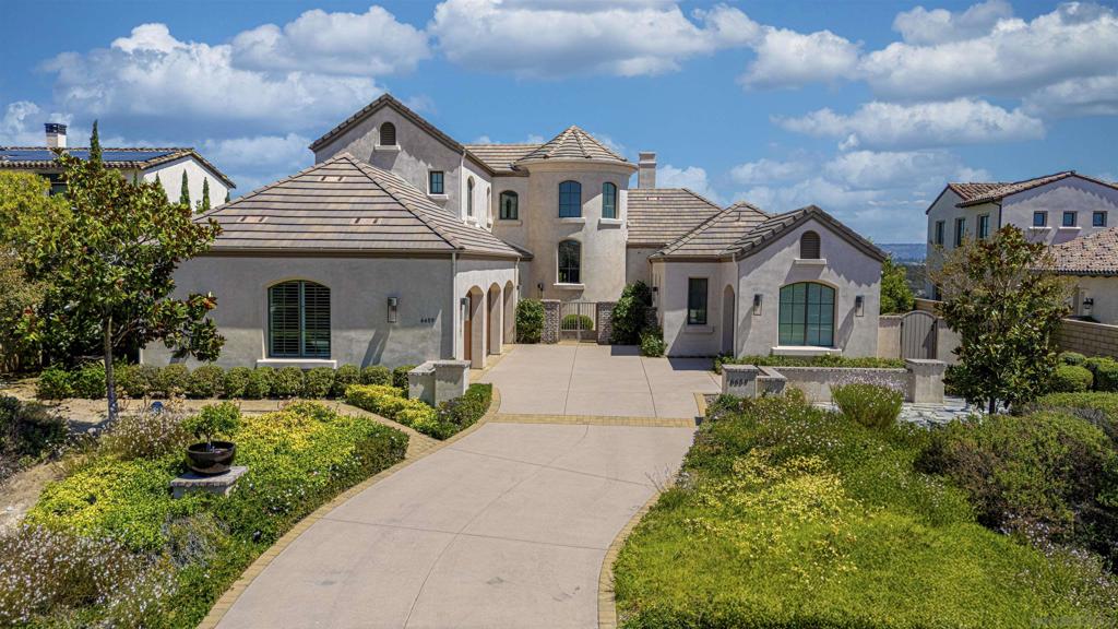 Custom canyon estate in the prestigious gated community of Alta Del Mar! Situated on a large, private, canyon lot with sweeping Eastward views! Greg Agee design and build with unmatched attention to detail and quality of finish. Chef's kitchen features stainless Wolf and Thermidor appliances centered around large island certain to be the heart of the home! Designed to blend indoor/outdoor living, the living room, accentuated by vaulted ceilings with warm wood beams, flows seamlessly to outdoor loggia and pool sized yard beyond! Wake up to the sunrise in your gorgeous first floor Primary Suite! Complete with fireplace, private patio and soaking tub it has everything you need to start and end your day right! All bedrooms feature en-suite baths and walk in closets. Large loft makes for great additional entertaining space, office, or kids play area! Let's not forget the Savant home automation, owned solar, 3 car garage!