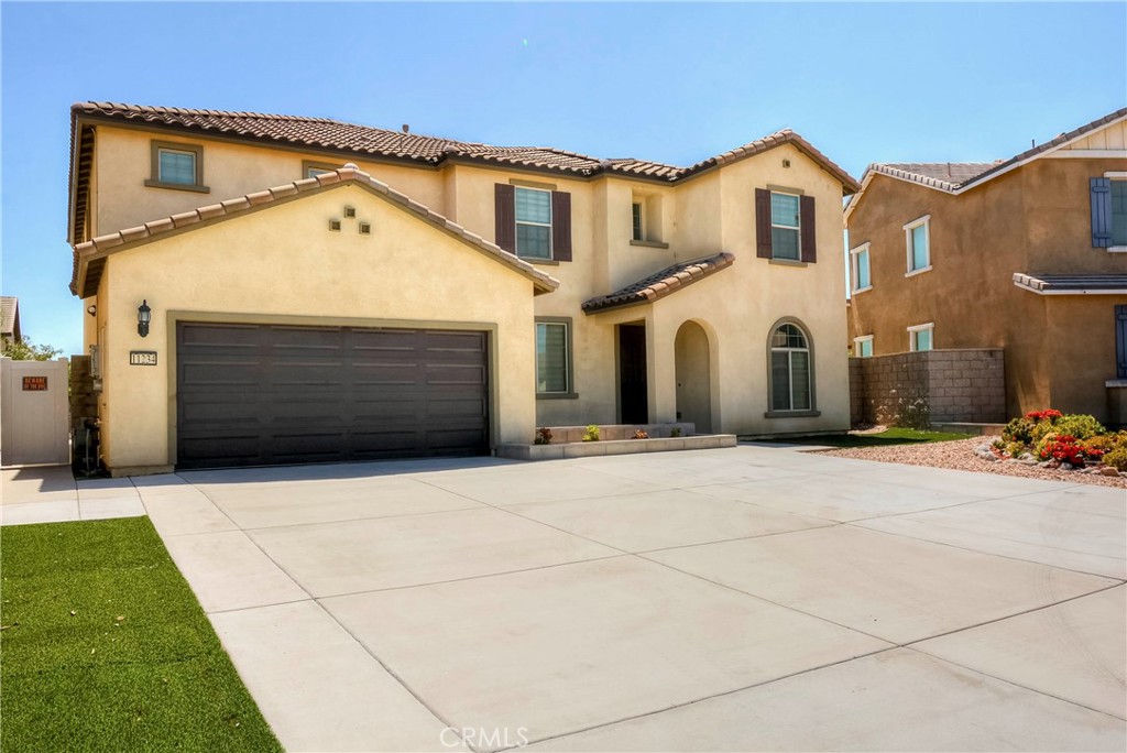 Welcome to this stunning two-story home offering 5 bedrooms, 4 bathrooms, and 3,317 sq. ft. of living space on a 7,405 sq. ft. lot. Designed for both comfort and style, the home features a spacious game room, upgraded cabinets and flooring, and a covered patio perfect for entertaining.
The gourmet kitchen boasts stainless steel appliances, a huge center island, and a dining area that opens seamlessly into the family room. The luxurious master suite includes a walk-in closet and a private bath, creating the perfect retreat. And EV cars charging, a soft water system, and PAID-OFF SOLAR.
Outdoors, enjoy a water-efficient front and backyard, complete with a gated dog run. The nature seen from the backyard provides a daily moment of rest.
Serrano Ranch, located in Jurupa Valley near the 60, 15, and 91 freeways, offers convenience with a nearby Metrolink station in Corona providing easy access to the greater Los Angeles area. Residents can take in panoramic Southern California views, enjoy year-round warm weather, and explore endless outdoor activities, including golfing and mountain hiking. Dining, shopping, and entertainment are just minutes away. The community also features a future neighborhood park, with more than 13 parks and over 234 acres of parkland within the JCSD Parks territory.
This beautiful home is move-in ready—don’t miss your chance to make it yours!