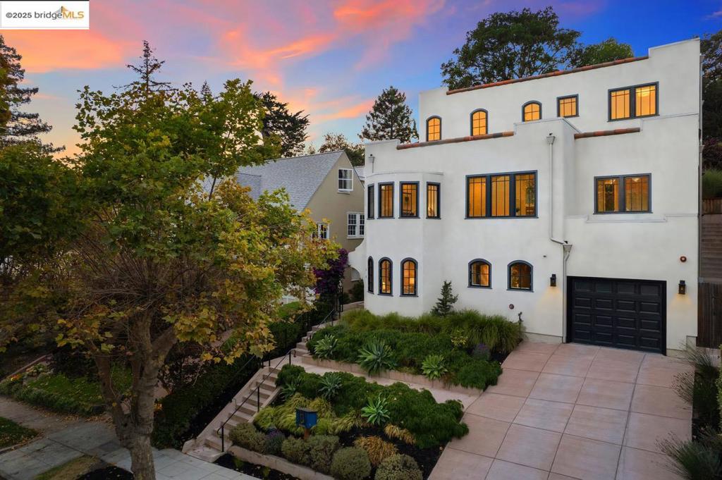 Modern Sanctuary in Crocker Highlands - Set in one of Oakland’s most cherished neighborhoods, this home was rebuilt & reimagined in 2021 to offer modern comfort w/ timeless character. Open spaces, soaring ceilings & warm natural finishes create a welcoming retreat. The open-concept kitchen is a gathering place for cooking, conversation & connection, anchored by a quartz waterfall island & complemented by Bertazzoni range, Bosch hood, Fisher & Paykel refrigerator, wine cooler & abundant storage overlooking gardens. The family room w/ seamless access to landscaped grounds features two majestic oaks, trunks intertwined as one, framing patios, turf play areas & lush gardens. Split-level dining & living rms provide striking neighborhood views & fireplace, plus guest bedroom & full bath. Upstairs, the primary suite offers spa-style bathroom w/ dual vanities & walk-in closet, joined by 2 bedrooms w/ cedar-floored closets & hall bath. Lower level includes den/office/guest suite w/ full bath & direct garage access. Smart features: laundry w/ smart appliances, solar panels, Cat wiring + mesh WiFi, pre-wired EV charging, dual fireplaces & whole-home sprinkler system. Mins to Award Winning Crocker Highlands Elementary, fabulous shops & dining, Sat Farmers Market, Lake Merritt & Bay Bridge.