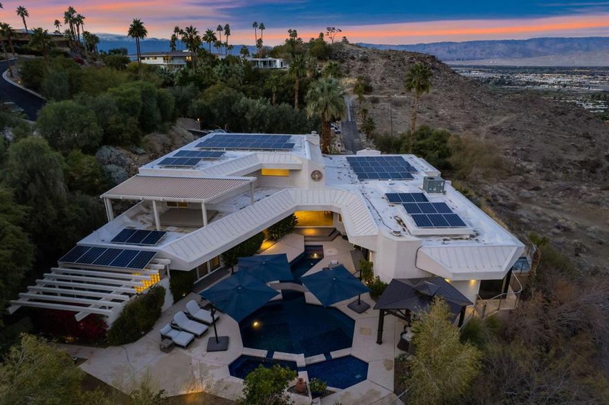 Breathtaking 270-degree views from this spectacular home in famous Southridge, an exclusive gated 22-home community nestled in the mountains and known for its long history of celebrity-owned homes, including those of Bob Hope, Steve McQueen, William Holden, Suzanne Somers, and the Elrod House, to name a few. This updated Mid-Century Modern home offers 270-degree views, including the Valley Floor from Palm Springs to the Salton Sea. The home offers five ensuite bedrooms, a powder room, and boasts a bright and open floor plan, extreme privacy, a quality pool/spa, a large patio with a built-in barbecue, and a private fire pit on the SW corner of this estate-sized lot. There's an additional private spa on the east side of the patio, offering the same spectacular Coachella Valley views and city lights at night. The perfectly appointed Chef's kitchen, floor-to-ceiling glass walls, ceiling fans, wet bar, electric blinds throughout, and the second workout room (converted from a 3rd garage stall) all make this home special. The second level offers one primary bedroom with a fireplace, a recently updated bathroom, a walk-in shower, a standalone soaking tub, a large walk-in closet, sliders to your private deck, and a separate lock-off office. An additional upstairs ensuite bedroom/exercise room has its Private 'Zen ' deck. Downstairs, you will find one more Primary Suite and two other En-Suite bedrooms, plus a powder room for your guests. Furnished per writtenInventory. Easy to show on short notice. You can contact either of the Listing Agents for a showing. Rick Parnell 360-280-4178 or Mark Brack at 760-515-7215. The Listing agent must accompany all showings. It is an exclusive neighborhood, and all visitors need to be accompanied by the listing agent.