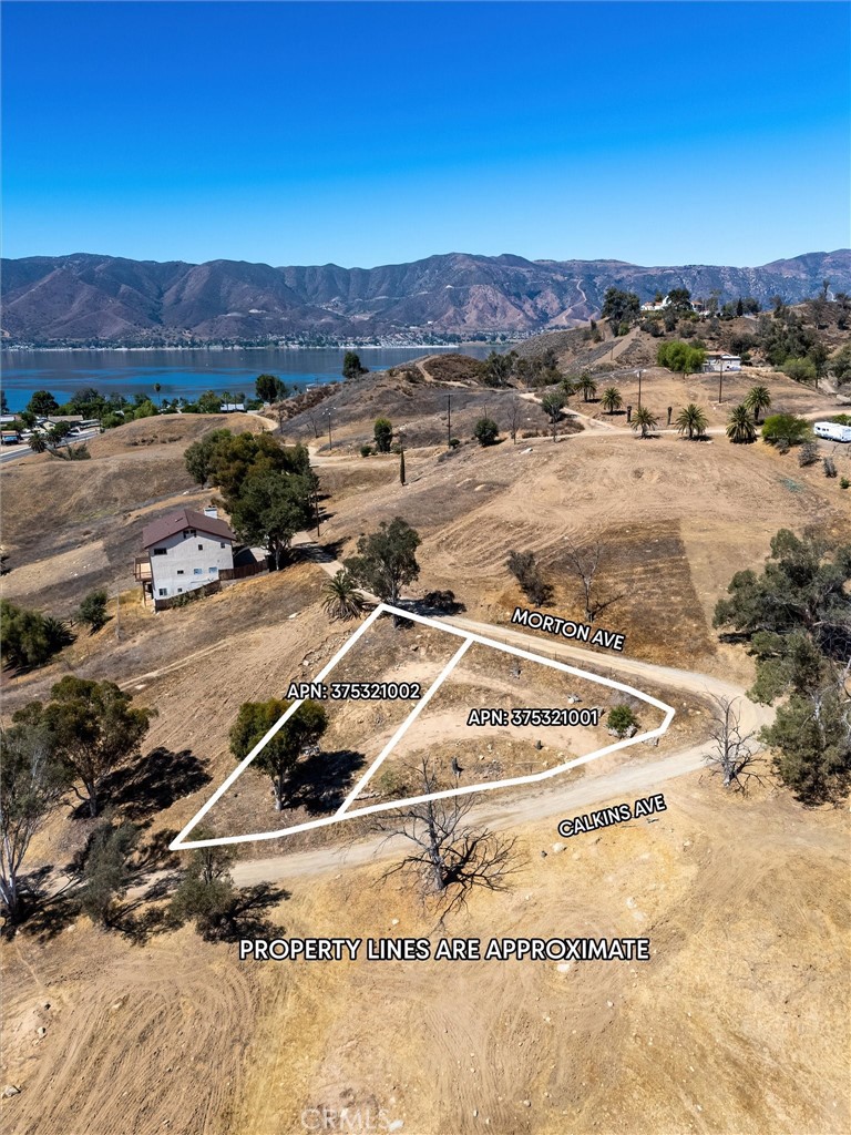 This exceptional property presents a rare opportunity to build your dream home or invest in a prime location in Lake Elsinore. This offering includes two contiguous lots, each with its own Assessor's Parcel Number (APN), all for one price. Situated on a private road, the property boasts stunning views of the city lights, providing a captivating backdrop for your future residence. The property is ideally prepared for construction, featuring two graded pads ready for a single-family home or a manufactured home, offering flexibility to the buyer's preferences. A significant advantage is the existing water meter and functional water service already in place, streamlining the building process. Electricity is readily accessible, with power poles located within 100 feet of the property, simplifying the connection process. Please note that a septic system will be required for sewer service. This property offers a unique opportunity to build a custom home in a desirable location with great views and convenient access to amenities and recreation. Location is key, and this property excels in that regard. It's conveniently located near schools, shopping centers, and a variety of restaurants, ensuring easy access to everyday necessities and leisure activities. Furthermore, the property is just a short 10-minute drive from the renowned Lake Elsinore, where you can enjoy boating, jet skiing, camping, and a multitude of other recreational opportunities. This property combines the tranquility of a private setting with the convenience of nearby amenities and the allure of lakeside recreation.
