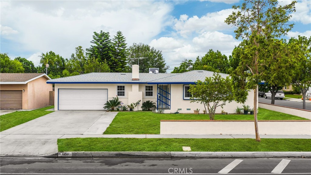 Welcome to this single-level residence, offering 1662 square feet of living space, four bedrooms, and 2.5 bathrooms. The property features an oversized 7800 square foot corner lot, a new HVAC system, and a recently replaced roof (2025). The home has been freshly painted both inside and out. The kitchen is equipped with new appliances, including a range, microwave, and dishwasher, along with quartz countertops. The laundry room is conveniently located near the guest bathroom. The family room boasts a fireplace and recessed lighting. The master bedroom is oversized with direct access to the master bathroom for added convenience and privacy. The three additional bedrooms are well-proportioned. Recessed lighting is installed throughout the entire house. The property also includes a 2-car garage and a covered patio, ideal for gardening. Centrally situated, the home is within minutes of Disneyland, major freeways, schools, and shopping centers.