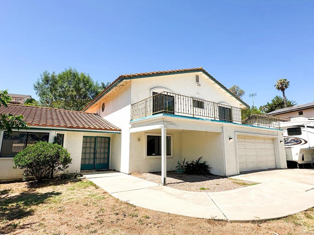 Bring your vision and unlock the potential of this custom home in Vista! Sitting on a spacious lot surrounded by mature trees, this property offers privacy, character, and endless possibilities. Inside, you’ll find generously sized rooms, a functional layout, and a unique architectural style just waiting to be brought back to life. Step out onto the balcony and take in peaceful views—this could be your dream retreat with the right touch. Enjoy the perks of RV parking, room for toys, and a location that puts you just minutes from freeways, shopping, dining, and entertainment. Whether you're an investor or a homeowner ready for a project, this is a rare opportunity to create something special.