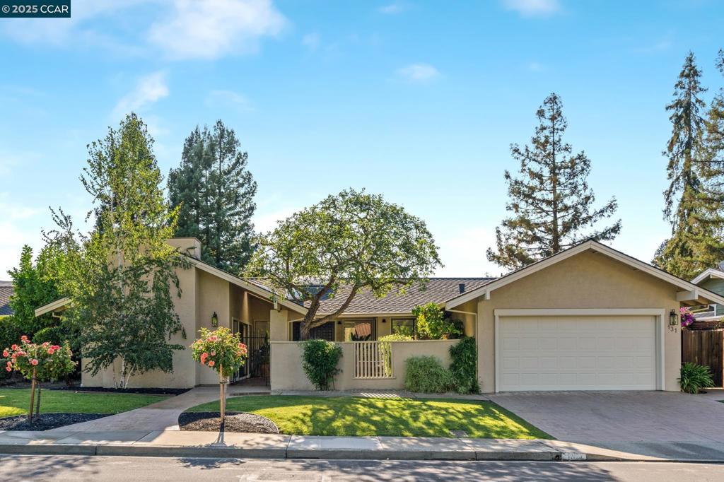 Ranch-style home in sought-after Sycamore neighborhood. Ideally located near a picturesque park, scenic walking paths & minutes from the community pool & tennis courts. Landscaped front yard &welcoming courtyard invite you inside. Lovingly maintained, this home retains much of its original charm while offering the perfect opportunity as a starter home, a move-up property, or a downsizing option. Step into the foyer, where fresh interior paint &abundant natural light create a bright atmosphere. The functional floor plan flows seamlessly,w/ formal dining room, eat-in kitchen w/ wood cabinetry & spacious walk-in utility closet.Sunny family room boasts a cozy fireplace with custom built-ins, while an additional formal living area w/ its own fireplace provides wonderful space for entertaining or relaxing. The bedroom wing includes three generously sized secondary bedrooms & full hall bath. Primary suite enjoys direct access to a large deck, offering a private retreat w/ tranquil outdoor views. The backyard is designed for entertaining, with an expansive deck and large grass area. The house has all new paint inside, new carpet, new dishwasher, new lighting and more. This prime location is just minutes from Iron Horse Trail, Downtown Danville, dining, shopping & top-rated SRVD schools.