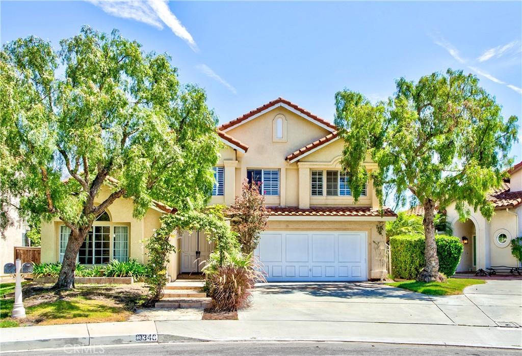 Would you like to live in the Castle? This stunning home is tucked at the end of a cul-de-sac, surrounded by mature California Pepper Trees. Step into an open floor plan with stunning stone floors throughout the entire downstairs. The chef’s kitchen is a true showstopper custom cabinetry with dish racks, wine glass slots, spice racks, wine chiller, soft-close drawers, and more. Gorgeous KitchenAid stainless steel appliances include a built in refrigerator, 8-burner stovetop, double commercial grade ovens, dishwasher, and microwave nook. The extended island with an eat-in kitchen table makes this the ultimate entertainer’s kitchen, no expense was spared! A custom enlarged wood staircase leads upstairs to the master suite and three additional bedrooms. The master retreat offers a peaceful view of Saddleback Mountain, ceiling fans, a spa like bathroom with a spacious walk-in shower, deep soaking tub, double vanity, mirrored walk-in closets with organizers and brand new carpet. Secondary bedrooms are generously sized with wood floors, ceiling fans, shutters and mirrored closet doors. A full hall bathroom with dual vanities completes the upstairs, finished with distressed hardwood flooring and tile in the baths. The private backyard, with no one behind you, is the perfect place to relax. All this is located in the heart of Laguna Niguel close to the lake, Dana Point Harbor, Laguna Beach, The Shops at Mission Viejo, top-rated schools, parks, and community events.