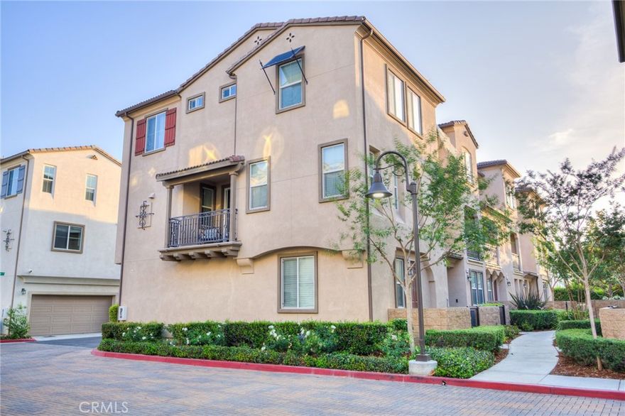 Newly Installed SPC Wood Flooring on the Two Levels. Beautiful 2016 Built - End Unit in the Gated Nexus Community by William Lyon Homes... This beautiful Tri-level End Unit home features 3 bedrooms, 2.5 bathrooms, Plus a den and 2-car attached garage. The entry level has direct access to the 2 car garage and boasts a beautiful den area which is being used as an office area. The second floor is an open concept with a large Living room, Dining room, kitchen with Granite counters, large island, white cabinetry and stainless steel appliances, and a private balcony to relax with your favorite drink. Also a convenient 2nd floor half bath. Located on the 3rd floor is the master bedroom , bathroom and a walk in closet, 2nd and 3rd bedrooms, a full bathroom and convenient laundry area. Enjoy the community pool, spa, playground and barbecue area. Walk able distance to the 24 Hours Fitness, Shops and Restaurants. Easy access to the 15 freeway and centrally located between the 60 and 91 freeways.