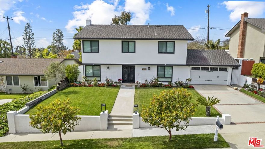 6923 Willowtree Drive is a beautifully remodeled two story home that combines modern design with everyday comfort. This five bedroom three bathroom residence is move-in ready and offers a rare blend of style, thoughtful updates, and inviting outdoor spaces in a quiet neighborhood near the coast. The main level features a spacious living room with a classic fireplace, an open dining area that leads to the backyard, and a stunning kitchen with custom cabinetry, marble accents, and premium stainless steel appliances. A versatile room on this floor, currently used as a home gym, sits next to a full bathroom. The attached two car garage provides direct access, built in ceiling storage, and a new washer and dryer. Upstairs you will find five generous bedrooms and two bathrooms, each refreshed and well-maintained to provide comfort and flexibility for family living, guests, or a home office. The primary suite includes a private bath, while other rooms enjoy backyard views and even a glimpse of the ocean. The backyard is designed for California living with a custom pergola, built-in barbecue, pizza oven, ambient lighting, and fresh landscaping that make it perfect for entertaining or relaxing outdoors.Extensive upgrades include new HVAC, windows, plumbing, and flooring, making this home truly turnkey. Conveniently located minutes from the Peninsula Shopping Center and the Promenade on the Peninsula, and close to parks and recreational areas, this property is a must see.