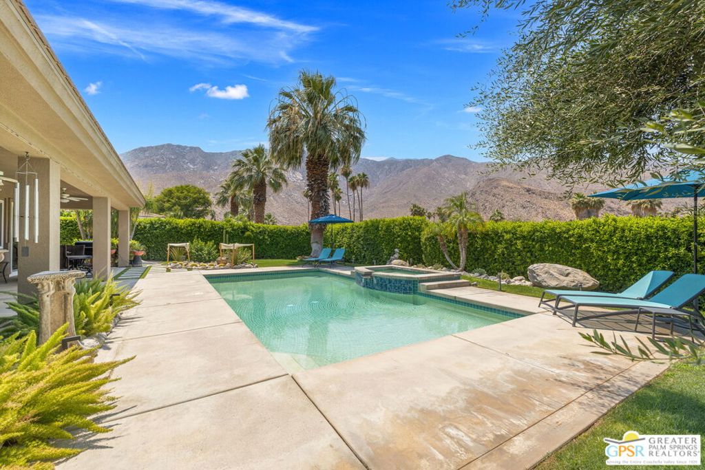 NEW Price, Same Wow! Now $200,000 Lower! Perfectly positioned at Andreas Hills atop the 15th tee of Indian Canyons Golf Resort's South Course! Outstanding San Jacinto Mountain views take things to the next level and the ultra-private pool and spa are ready for the pages of Palm Springs Life. Hedged and private, this is the desert good life! The mix of conversation areas is a pleasant surprise, perfect for entertaining. Living and dining rooms enjoy a nice separation with a newer tiled fireplace working its magic. The open-concept kitchen with a large island, breakfast area, and walk-in pantry is a hit. Oversized windows throughout let in tons of natural light and frame the views. There is also a den/media room which opens onto the patio, indoor/outdoor living at its best. The primary suite features mountain and pool views, direct patio access, and an updated bath with dual vanities, skylight, a soaking tub, walk-in shower with two shower heads, and a large walk-in closet. Junior Ensuite Two, on the opposite side, has its own private bath and walk-in shower. Junior Ensuite Three, currently used as an office, comes with its own full bath.Additional features include an interior laundry room with sink, powder bath, and a fully air-conditioned three-car garage. Recent updates include brand-new windows and doors (2024), roof work, and new skylights. Golf lovers will appreciate the back gate that opens up to the fairway. The backyard? Grapefruit, tangerine, mango, and avocado trees, all surrounded by swaying palms and private hedges. Landscaping is next level, with mature trees and lighting that sets the mood when the sun goes down, and westward views for the ultimate sunset backdrop. Minutes from downtown Palm Springs, hiking trails, and golf, this home gives you ultimate privacy without sacrificing convenience. Plus, it's qualified for short-term vacation rental, so whether you're living in it or renting it out, you're in a prime spot. Take the Matterport Virtual Tour and see it all in motion.