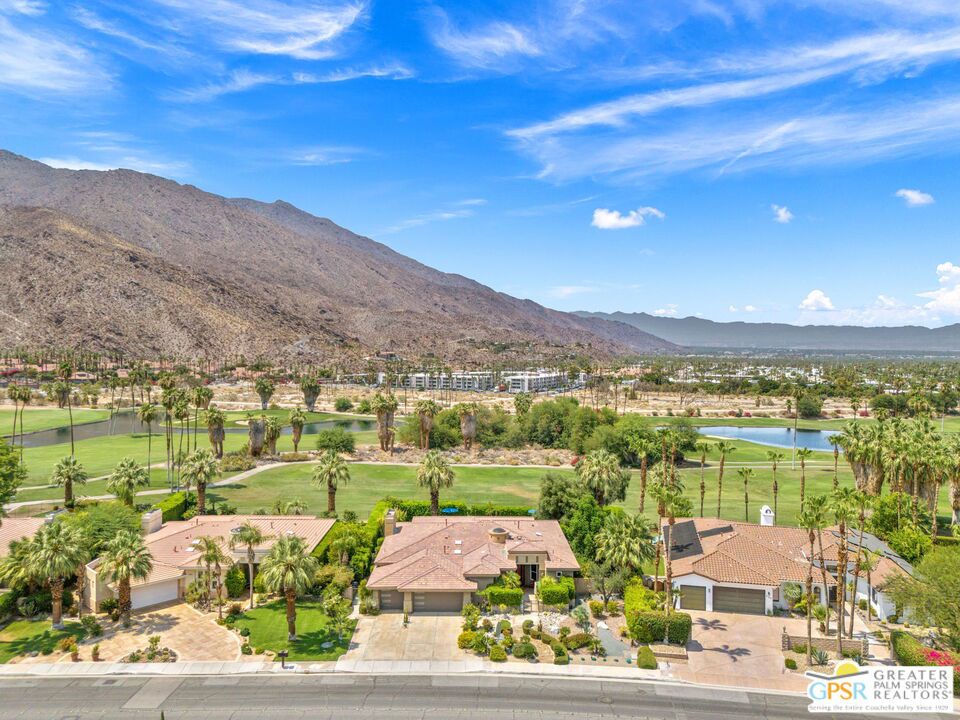 NEW Price, Same Wow! Now $200,000 Lower! Perfectly positioned at Andreas Hills atop the 15th tee of Indian Canyons Golf Resort's South Course! Outstanding San Jacinto Mountain views take things to the next level and the ultra-private pool and spa are ready for the pages of Palm Springs Life. Hedged and private, this is the desert good life! The mix of conversation areas is a pleasant surprise, perfect for entertaining. Living and dining rooms enjoy a nice separation with a newer tiled fireplace working its magic. The open-concept kitchen with a large island, breakfast area, and walk-in pantry is a hit. Oversized windows throughout let in tons of natural light and frame the views. There is also a den/media room which opens onto the patio, indoor/outdoor living at its best. The primary suite features mountain and pool views, direct patio access, and an updated bath with dual vanities, skylight, a soaking tub, walk-in shower with two shower heads, and a large walk-in closet. Junior Ensuite Two, on the opposite side, has its own private bath and walk-in shower. Junior Ensuite Three, currently used as an office, comes with its own full bath.Additional features include an interior laundry room with sink, powder bath, and a fully air-conditioned three-car garage. Recent updates include brand-new windows and doors (2024), roof work, and new skylights. Golf lovers will appreciate the back gate that opens up to the fairway. The backyard? Grapefruit, tangerine, mango, and avocado trees, all surrounded by swaying palms and private hedges. Landscaping is next level, with mature trees and lighting that sets the mood when the sun goes down, and westward views for the ultimate sunset backdrop. Minutes from downtown Palm Springs, hiking trails, and golf, this home gives you ultimate privacy without sacrificing convenience. Plus, it's qualified for short-term vacation rental, so whether you're living in it or renting it out, you're in a prime spot. Take the Matterport Virtual Tour and see it all in motion.