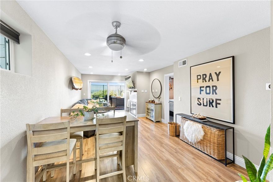 Welcome to this stunning, updated end-unit home designed for modern coastal living! Step through the private, gated entry and into a bright open floor plan featuring new contemporary wood laminate flooring, dual-pane windows, and designer touches throughout.

The stylish kitchen boasts crisp white cabinetry, quartz countertops, and stainless steel appliances, opening seamlessly to the dining area and spacious living room—complete with a cozy fireplace accented with custom subway tile.

Relax and entertain on your private patio while enjoying ocean breezes and panoramic views. Both bedrooms are generously sized and positioned on opposite sides of the home, ensuring comfort and privacy. The primary suite overlooks serene views and offers a beautifully remodeled ensuite bath with a dual-sink vanity and modern finishes.

Additional highlights include in-unit laundry, a private garage, and a prime location close to trails, beaches, top-rated schools, shopping, and restaurants. Just steps from Fairview Park—perfect for outdoor adventures and summer concerts!