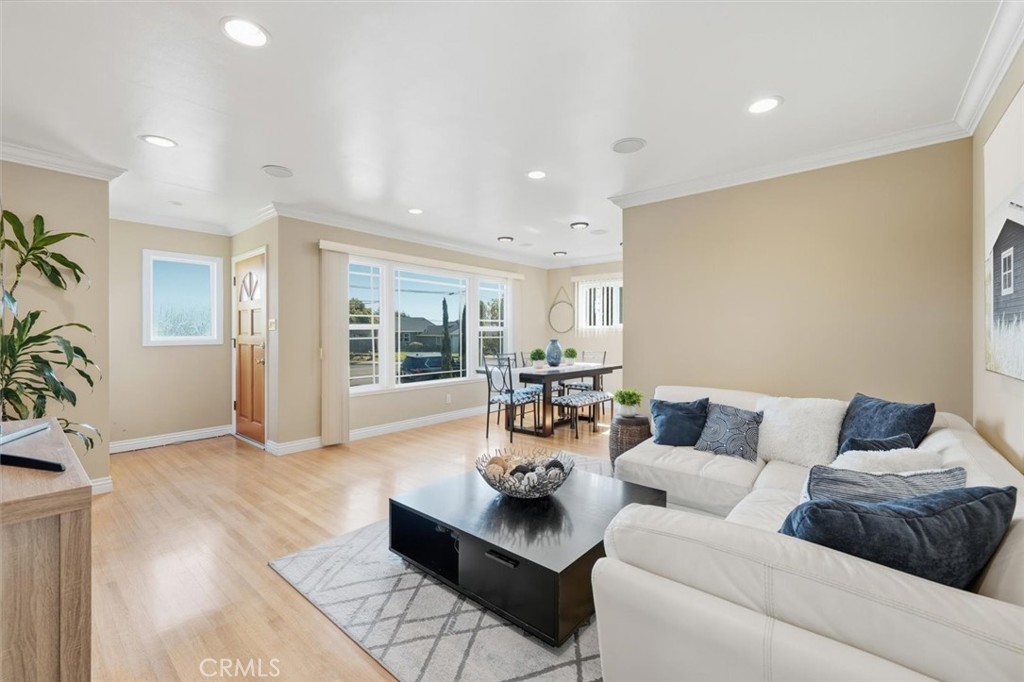 Why does everyone fall in love with Southwood West Torrance? Maybe it’s the ocean breeze that greets you each morning, or the peaceful, tree-lined streets that feel like a hidden pocket of paradise, just over a mile from the beach. This charming, meticulously maintained home has been lovingly cared for by its owners. It radiates character and is gracefully blended with thoughtful upgrades. Inside, sunlight pours through a large front window, illuminating beautiful hardwood floors, elegant crown molding, and recessed lighting. The remodeled kitchen is both stylish and practical, offering abundant cabinetry and storage for all your culinary treasures. The open living and dining areas flow seamlessly, creating a warm and welcoming space to gather, relax, and unwind. The private primary suite includes its own attached bathroom, while the two west-facing bedrooms enjoy gentle afternoon light and share a spacious, remodeled hallway bath. Step outside to an expansive backyard that invites you to slow down, bask in the sun, feel the coastal breeze, plant a garden, or host family and friends for weekend barbecues. A long driveway provides plenty of parking, with room for an RV or boat, and leads to a detached two-car garage. Just over a mile to Redondo beach and The Riviera Village, this sought-after West Torrance location captures the essence of the South Bay lifestyle: morning jogs at the beach, evening bike rides along the sand, exploring local shops at Del Amo mall, and dining at gourmet restaurants. You’re close to award-winning West Torrance schools, beautiful Paradise Park, and the serene trails of Wilderness Park. Whether you’re biking to the Redondo Pier, strolling through The Strand, or savoring coffee at a nearby café, every day here feels like a coastal getaway. This is your chance to own a truly special piece of South Bay living—an inviting, sunlit home where comfort meets charm.
