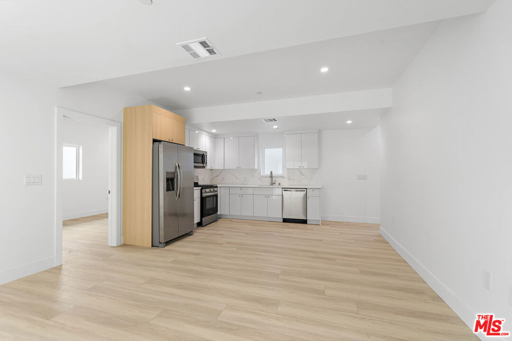Experience modern luxury living in the heart of North Hollywood! This stunning, newly constructed 3-bedroom, 3.5-bathroom townhouse is part of an exclusive, brand-new 14-unit complex that blends contemporary design with high-end finishes and an unbeatable location.Inside, you'll find an expansive open-concept floor plan with soaring ceilings and an abundance of natural light. The chef's kitchen is equipped with top-tier appliances and premium finishes, while the living and dining areas offer a seamless flow, creating an ideal space for both entertaining and everyday living.The private primary suite is a true retreat, featuring an en-suite bathroom and a spacious walk-in closet. The additional bedrooms are thoughtfully designed and versatile, offering ample space for family, guests, or a home office. The rooftop deck provides the perfect spot to unwind, offering breathtaking views and ample room for outdoor living. This unit also includes in-unit laundry, plenty of storage, and energy-efficient systems for ultimate convenience and comfort. Located just minutes from the vibrant NoHo Arts District, Universal Studios, and an array of dining, shopping, and entertainment options, you'll be at the epicenter of all that North Hollywood and Hollywood have to offer. With two covered parking spaces and easy access to major freeways and public transit, your commute will be a breeze. Don't miss out on the chance to lease this brand-new luxury townhouse in one of L.A.'s most desirable neighborhoods.