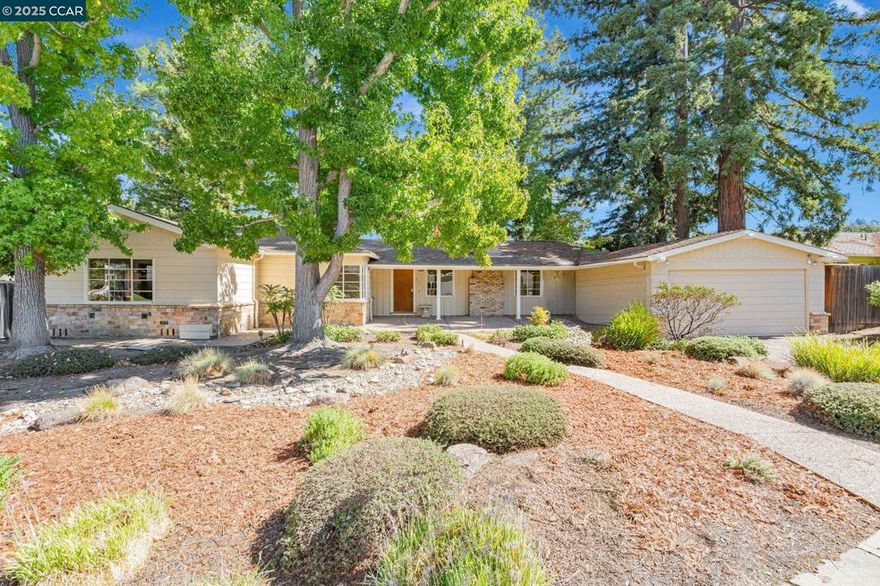 Location, Location, Location! Opportunity knocks to transform this classic Lafayette Trail neighborhood rancher into the home of your dreams. Nestled on a pancake-flat, quarter-acre lot, this property offers endless potential for updating, expansion, or simply enjoy.  The home features hardwood floors, beautiful mature trees, and period details including stone trim, traditional wood siding, a covered front porch, rear patios, and charming walkways. Enjoy the spacious front and back yards, lovingly maintained and surrounded by lush landscaping. A two-car garage with built-in cabinets and ample storage plus large side yards provide space for gardening, play, or future landscape improvements. This is a rare opportunity to own in one of Lafayette’s most sought-after neighborhoods—close to the Lafayette Trail, top-rated schools, and all that  downtown Lafayette has to offer.  Tell a friend.  Open Saturday 10/11 & Sunday 10/12.