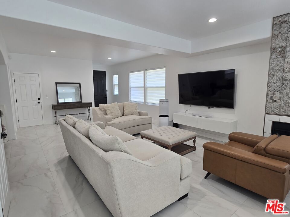 This beautifully renovated home features 3 spacious bedrooms and 3 fully updated bathrooms. The modern kitchen boasts stunning new quartz countertops, sleek cabinetry, and brand-new LED lighting. Fresh paint and stylish tile flooring flow throughout the home, creating a warm and inviting atmosphere. A custom walk-in closet and pantry add extra charm and functionality. Plus, the attached 2-car garage offers convenience and ample storage space.
