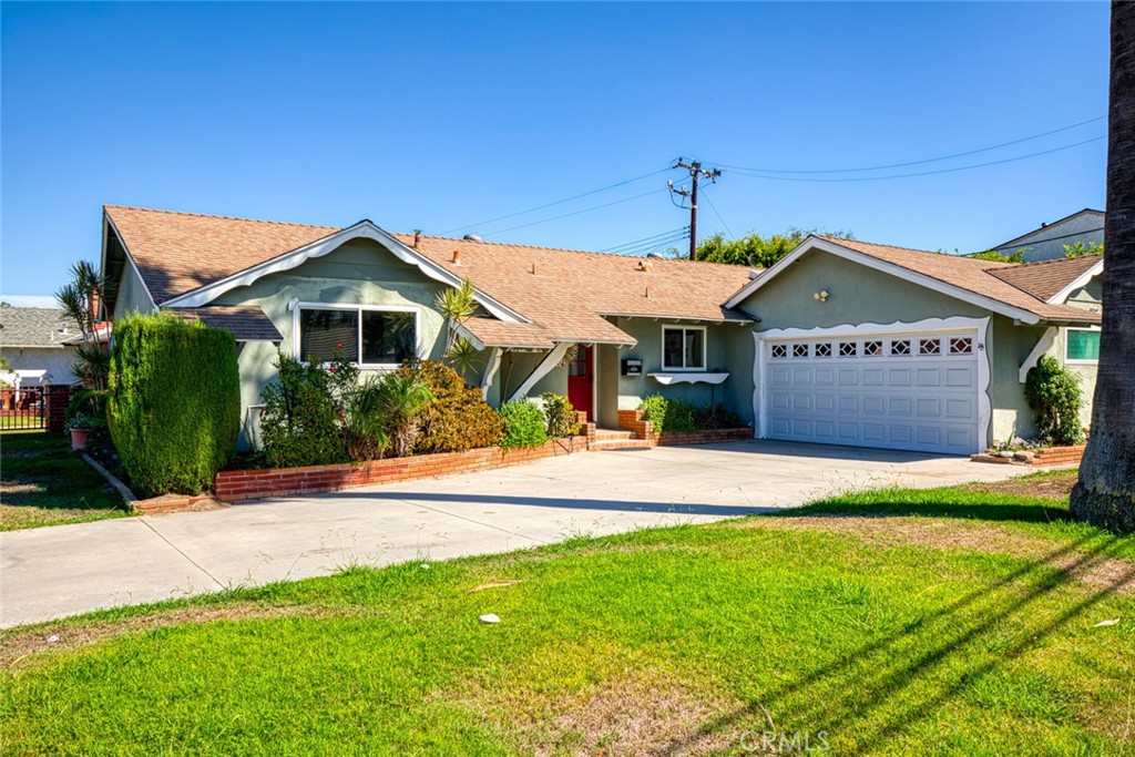 Welcome to this charming single-family residence in the highly desirable city of Garden Grove. Situated on a beautiful corner lot with exceptional curb appeal, this home blends classic style with modern convenience. The exterior showcases a Dutch Queen Anne design, complemented by a spacious driveway that can easily accommodate an RV, boat, or trailer. Inside, you’ll find 4 bedrooms and 2 bathrooms, including a master suite. One of the bedrooms is generously sized and can double as a family room with direct access to the backyard. The bright and open living room features an inviting fireplace, perfect for gatherings. The cozy breakfast nook with vaulted ceilings flows seamlessly into the light-filled galley kitchen, complete with granite countertops and two skylights that enhance the natural light. The large backyard is ideal for entertaining and family activities, offering a covered patio, storage shed, bamboo trees, and a citrus tree. There’s plenty of room for kids to play or for relaxing outdoors. Additional highlights include a newer air and heating system and a spacious two-car garage. This home is within walking distance of award-winning Garden Grove schools and just minutes from top shopping destinations such as The Outlets at Orange, South Coast Plaza, and Westminster Mall. Plus, Disneyland is only minutes away! With its prime location, spacious layout, and endless potential, this property is ready for you to call home.