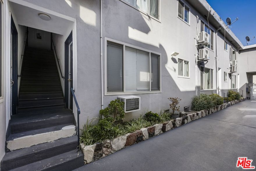 Charming, quiet, and secure building in one of West Hollywood's best areas. This pristine, bright 2BR/2BA upper unit boasts over 1100 SF, stylish hardwood floors throughout, a newly remodeled kitchen with stainless appliances and granite countertops, recessed lighting and an AC unit. Two spacious bedrooms with an abundance of closet space as well as a remodeled bathroom with tiled shower round out the excellent floor plan. Stackable washer/dryer as well as extra storage in the hallway. Street parking only. Nestled between incredible restaurants, shops, and bars on both Santa Monica Blvd. and Melrose Ave., including Or Bar, Jones Hollywood, Connie & Ted's, Breakfast by Salt's Cure, Ronan, The Benjamin and Walking Spanish - you couldn't pick a better location to call home!