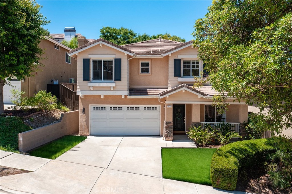 Completely remodeled home originally built in 2002 located South of the Boulevard at the end of a cul-de-sac. Elevated above the street, the front yard features driveway that leads to the 2-car garage and a wide covered front porch. Step inside to find a completely open floor plan with designer finishes and custom details. The formal living room features a wood mantled fireplace, large picture window overlooking the front yard, and wide plank wood floors found throughout. A separate formal dining room has two-story soaring ceilings with direct kitchen access. The chef’s gourmet kitchen boasts center island with breakfast bar seating, quartz counters with custom soft close cabinetry, stainless appliances, pantry space with pullout drawers, and breakfast nook with built-in bench seating. The kitchen opens directly to the separate spacious family room with French doors that open to the backyard. The first floor also features a downstairs bedroom ideal for guests or office space with access to a remodeled hall bathroom with walk-in shower. A separate laundry room has built-in storage cabinetry and access to the 2-car finished garage with overhead storage racks. Upstairs you will find three additional bedrooms plus an oversized loft/work space with built-in desks and storage - perfect flex space for play room/gym/etc. The luxurious primary suite is located on a private wing boasting double door entry, high vaulted ceiling, walk-in closet with second additional wardrobe closet, and en-suite remodeled bathroom with custom vanity with dual sinks, quartz counter, built-in linen storage, soaking tub, seamless walk-in shower, and separate toilet room. The two well appointed secondary bedrooms each have closets with built-ins and they share a remodeled hall bathroom with custom vanity, dual sinks, bath tub, and shower. The private backyard features large patio with overhead string lights perfect for entertaining and dining alfresco, built-in gas fire pit, & lush landscaping with mature trees that provide wonderful shade. Adjacent to dining & shopping at the Calabasas Commons, nearby markets including Bristol Farms & Trader Joes, close proximity to the Westfield Mall/Village & Warner Center, and zoned for highly acclaimed Calabash elementary, Hale and El Camino charter schools.