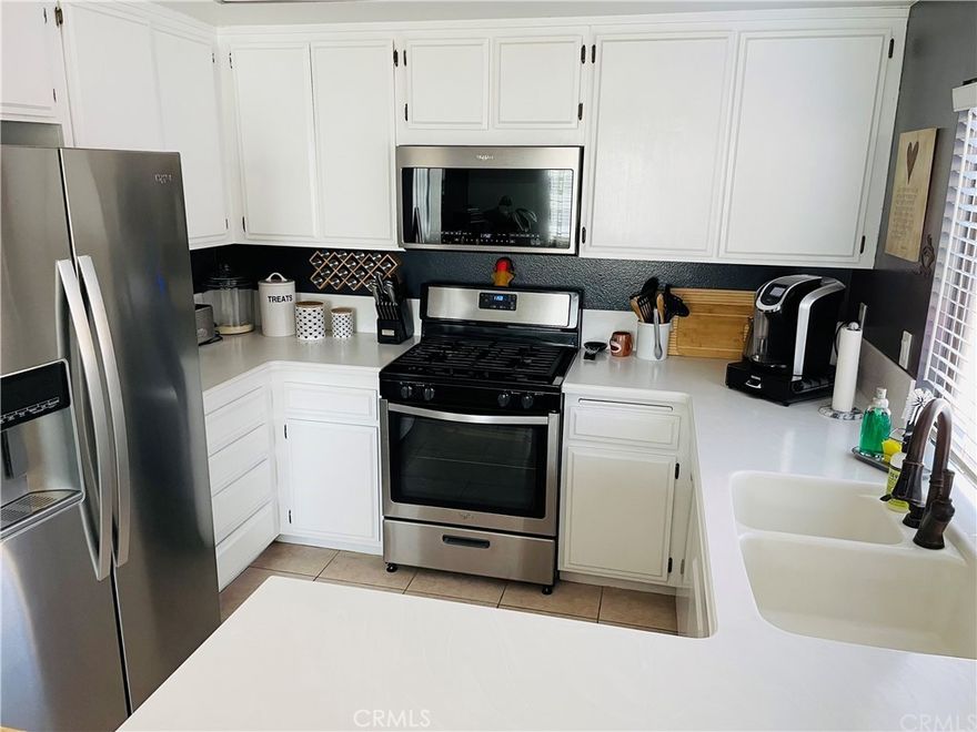 Welcome to this beautifully maintained end unit located on the second floor in the highly desired Millstream gated community of Huntington Beach! This inviting 2-bedroom, 1.25-bath residence offers the perfect blend of comfort, privacy, and style — with all living space conveniently situated on one level. Enjoy the bright and open floor plan featuring luxury vinyl flooring throughout, creating a clean, modern feel. The spacious living area opens to a private enclosed outdoor patio, ideal for relaxing or entertaining. As an end unit, the home enjoys added privacy and an abundance of natural light.

Additional highlights include a well-appointed kitchen, generous storage, a convenient in-unit laundry area, a one-car garage, and plenty of guest parking. The Millstream community offers beautifully landscaped grounds, tranquil streams and waterfalls, pool, spa, and tennis courts — all within a secure, well-maintained gated neighborhood. Located just minutes from the beach, shopping, dining, and top-rated schools, this home perfectly captures the relaxed coastal lifestyle that Huntington Beach is known for.